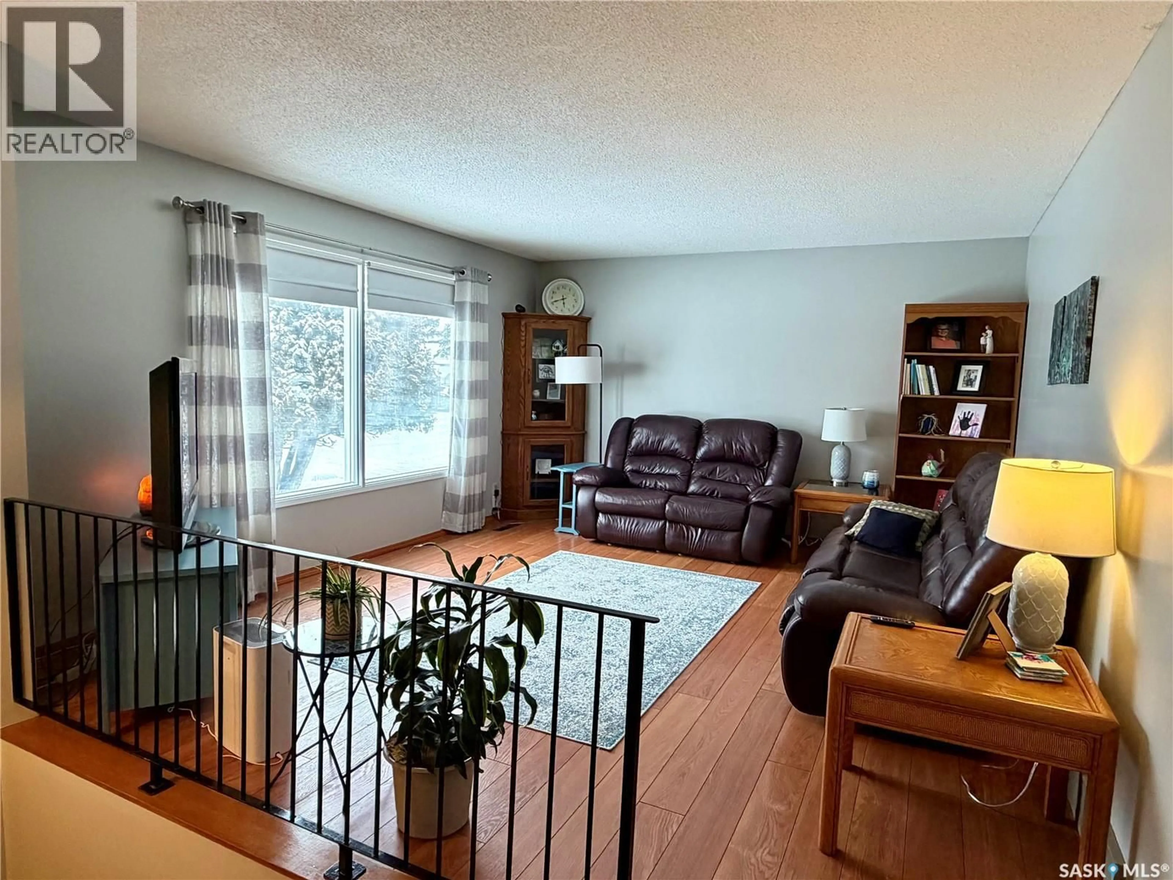 Living room with furniture, wood/laminate floor for 412 2ND AVENUE, Spiritwood Saskatchewan S0J2M0