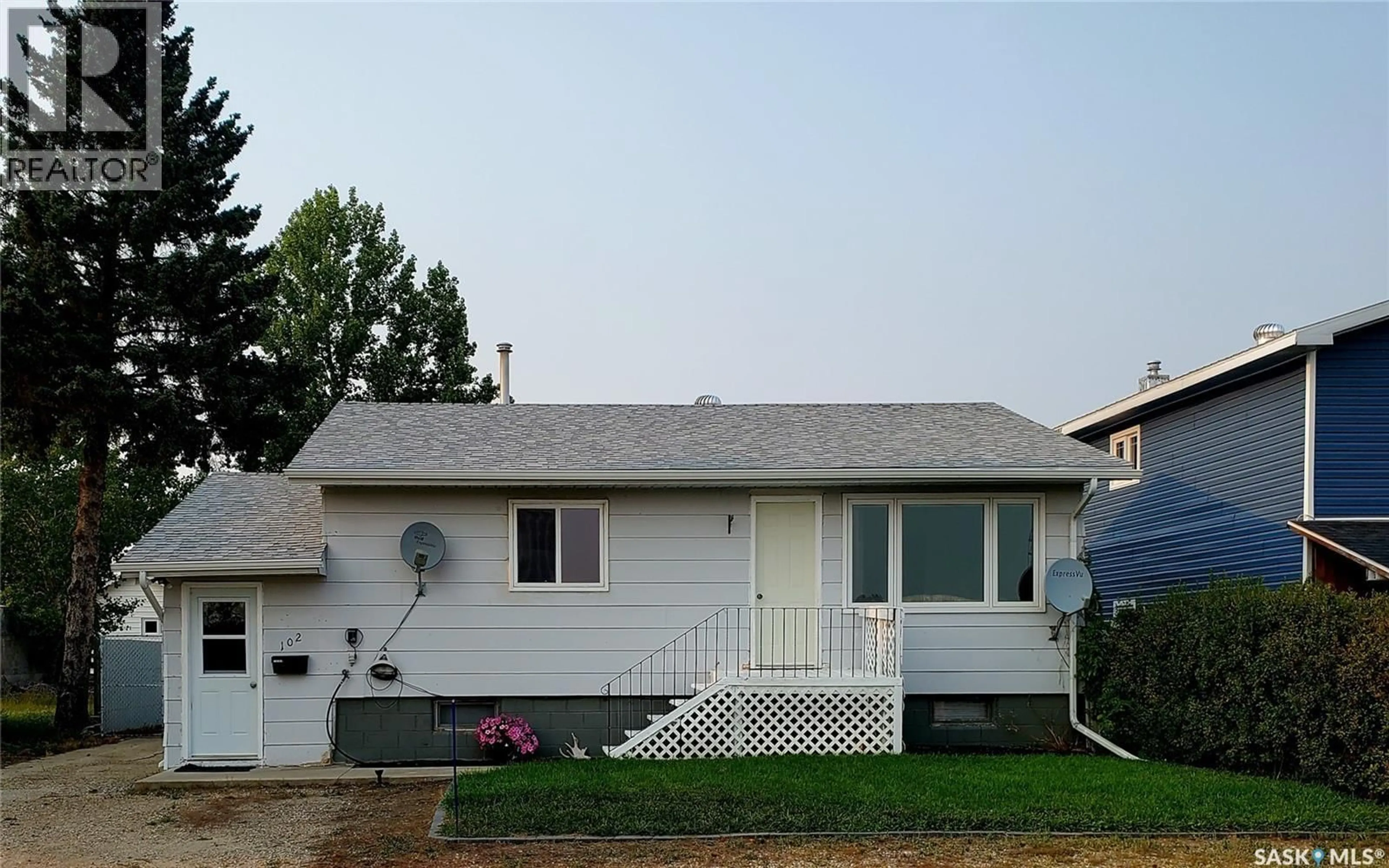 Home with vinyl exterior material, street for 102 RAILWAY AVENUE, Waldeck Saskatchewan S0H4J0