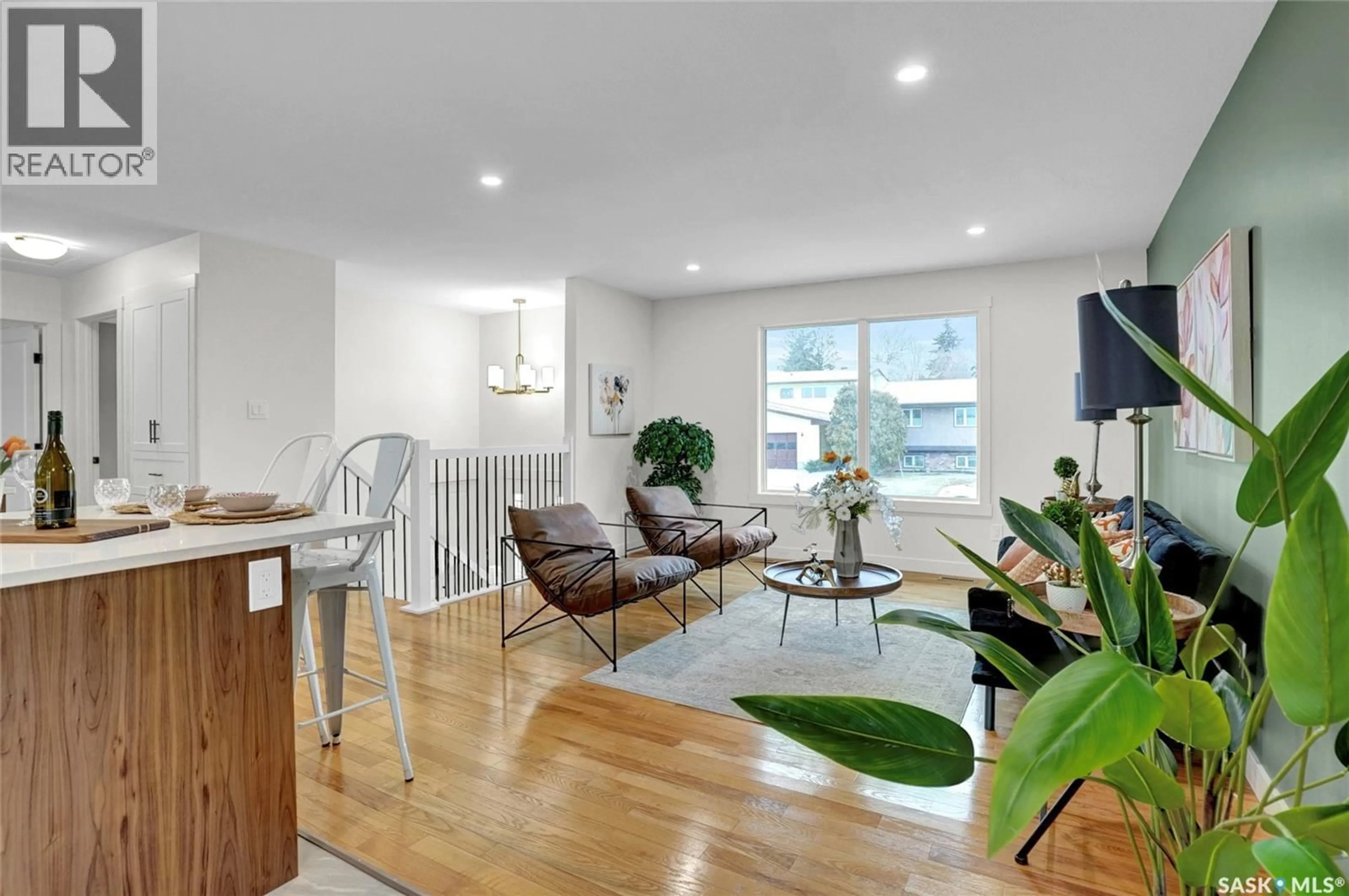 Living room with furniture, wood/laminate floor for 12 BUTTERCUP CRESCENT, Moose Jaw Saskatchewan S6J1A4