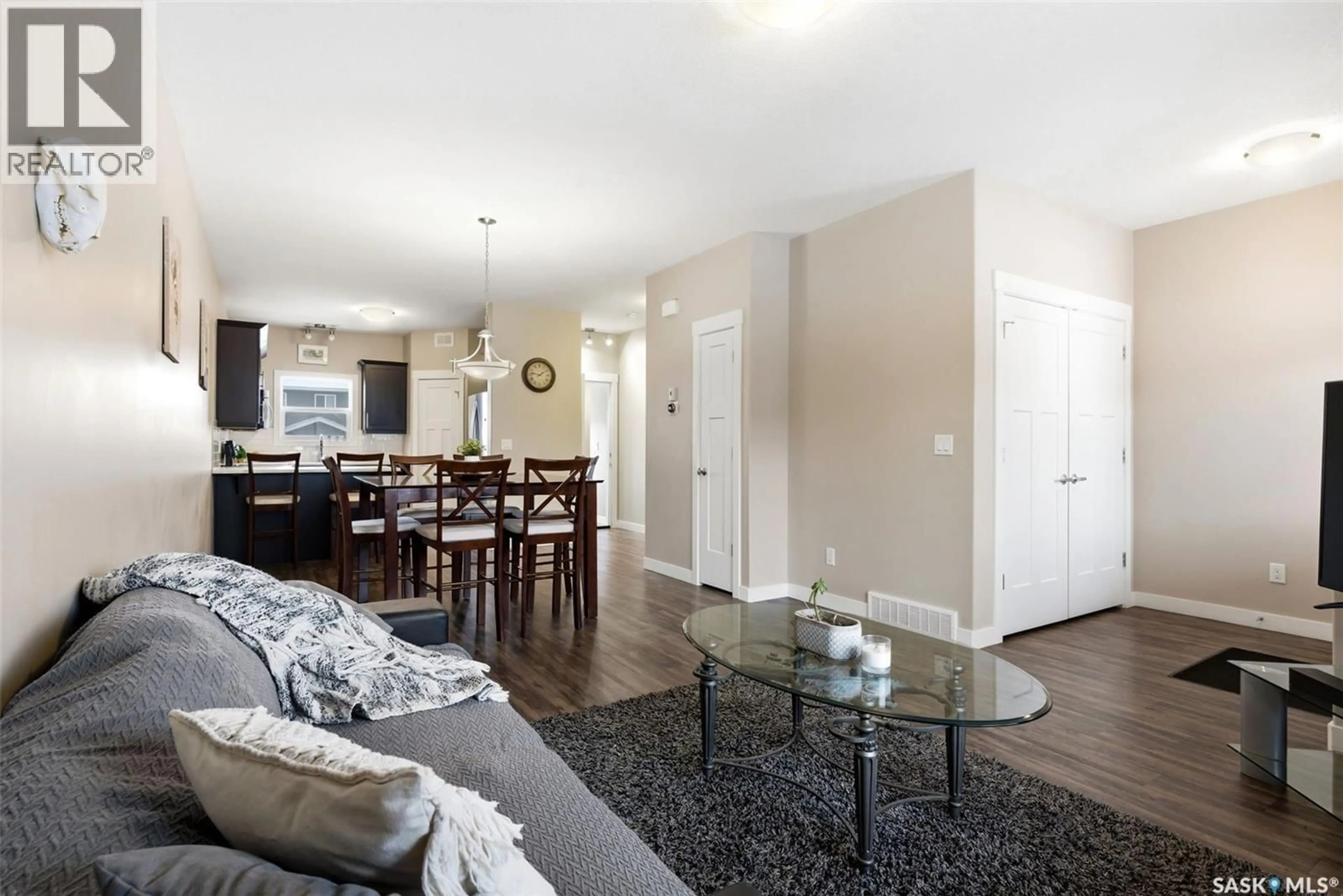 Living room with furniture, wood/laminate floor for 5610 CAMPLING AVENUE, Regina Saskatchewan S4W0P7