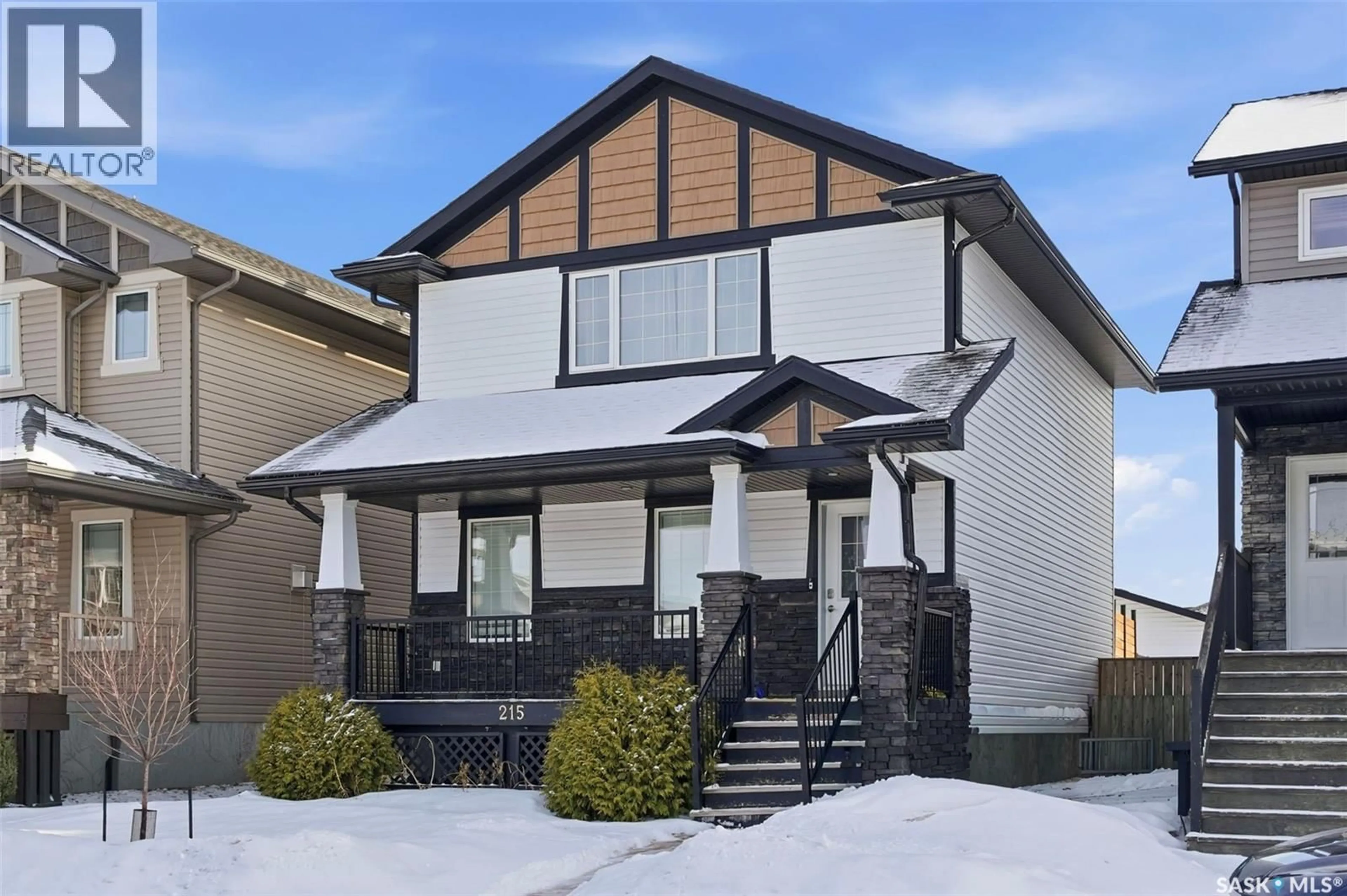 Home with vinyl exterior material, street for 215 WYANT LANE, Saskatoon Saskatchewan S7W0L2