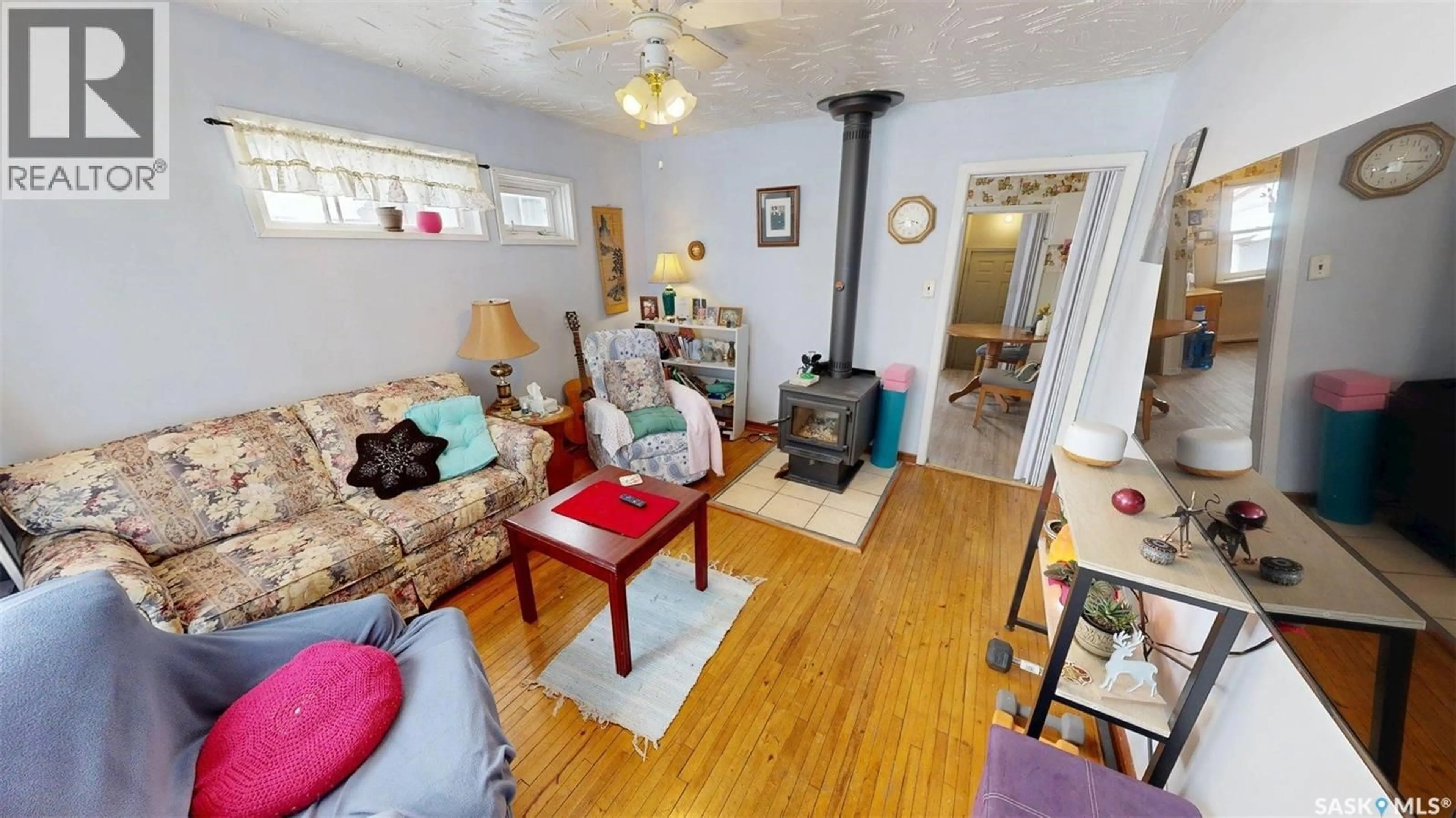 Living room with furniture, wood/laminate floor for 1603 13TH STREET, Prince Albert Saskatchewan S6V3J9