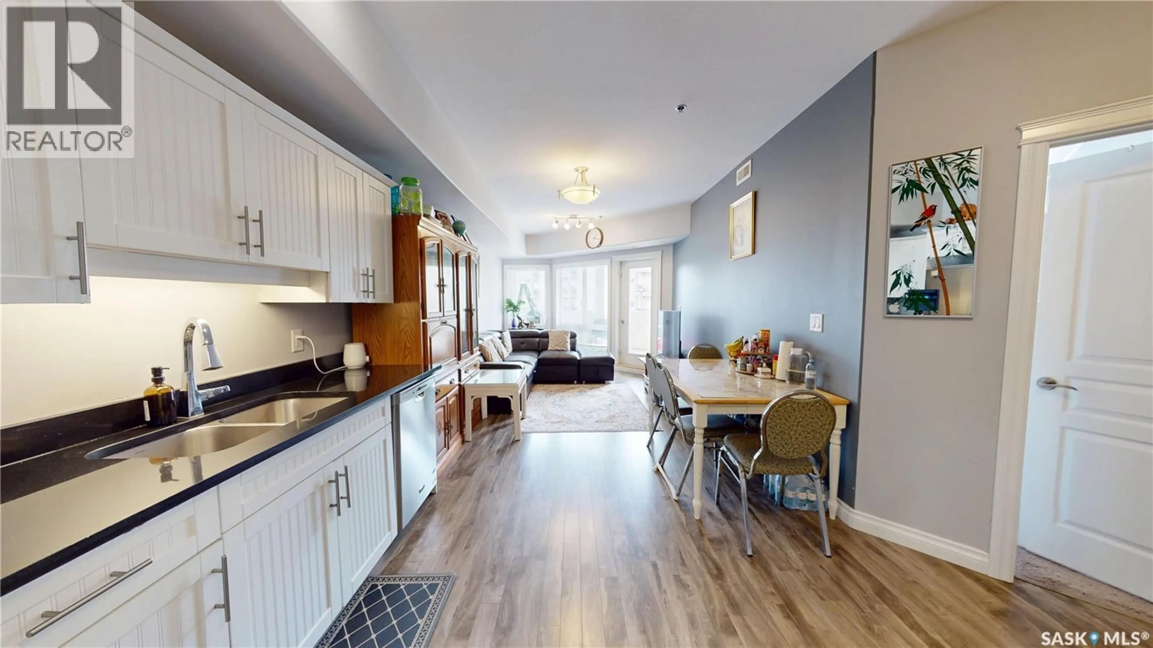 Open concept kitchen, wood/laminate floor for 412 - 214 WILLOWGROVE SQUARE, Saskatoon Saskatchewan S7W0T2