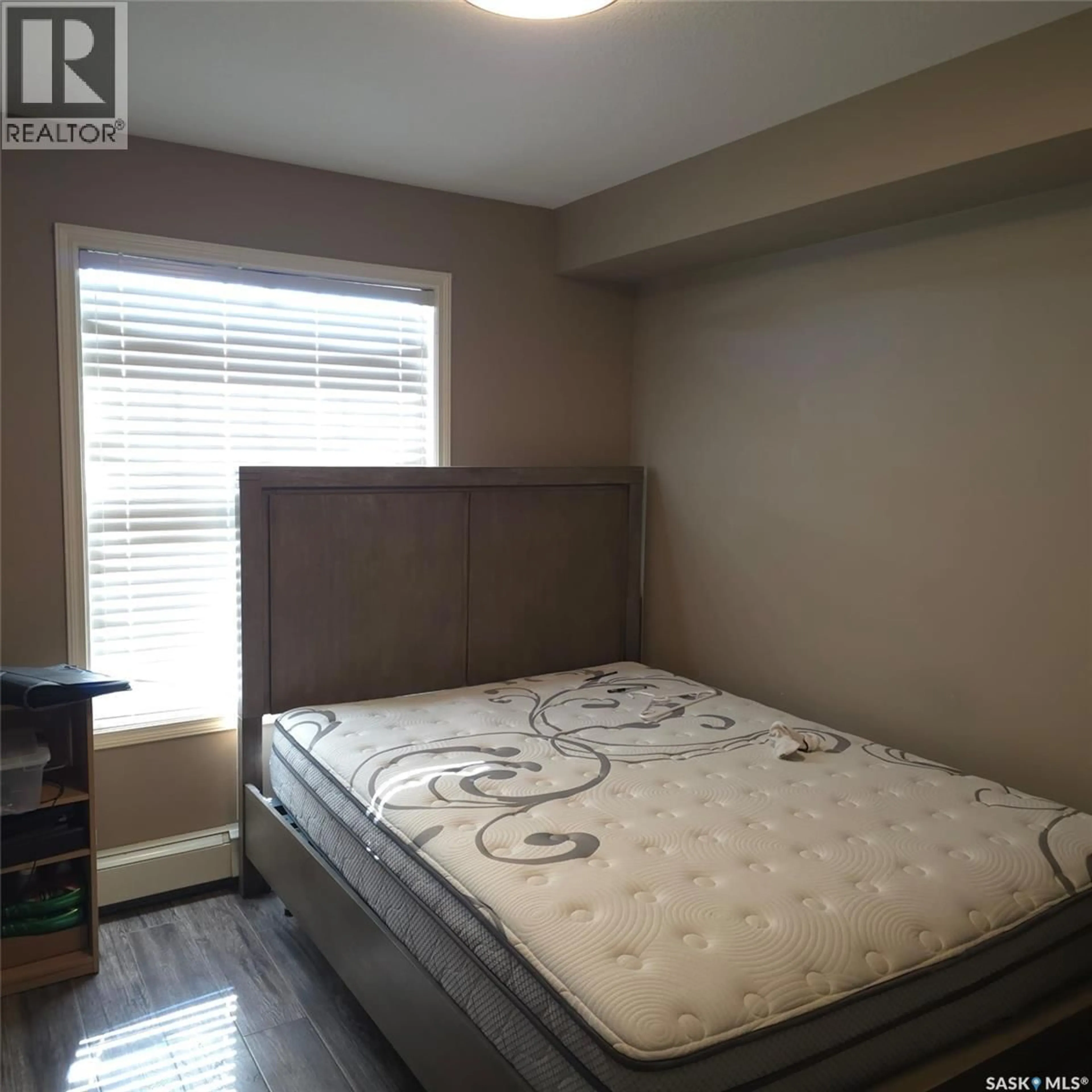 Bedroom with bed, wood/laminate floor for 316 326 HEROLD ROAD, Saskatoon Saskatchewan S7V0A2