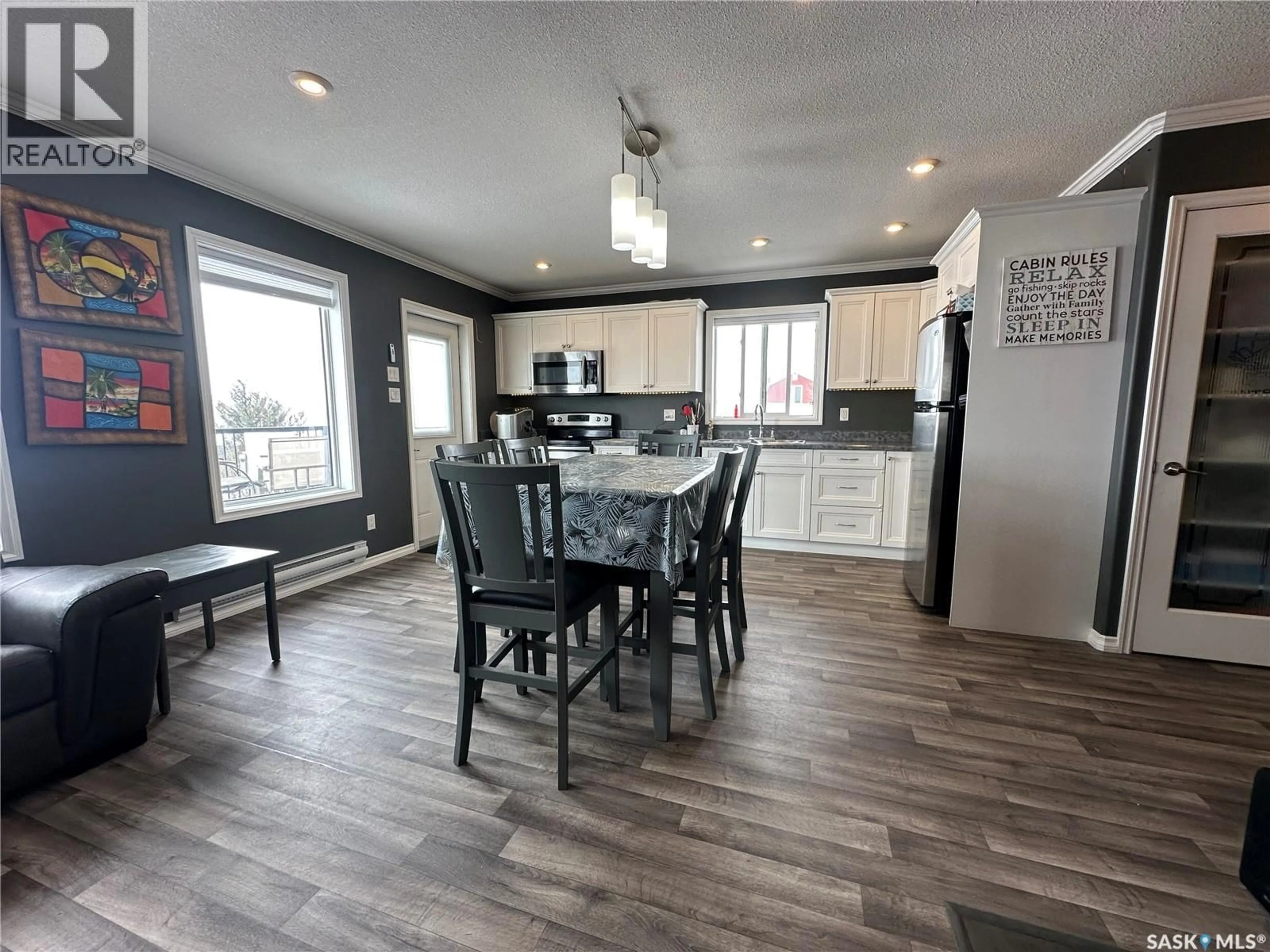 Open concept kitchen, wood/laminate floor for 825 PARK DRIVE, Good Lake Rm No. 274 Saskatchewan S0A0L0