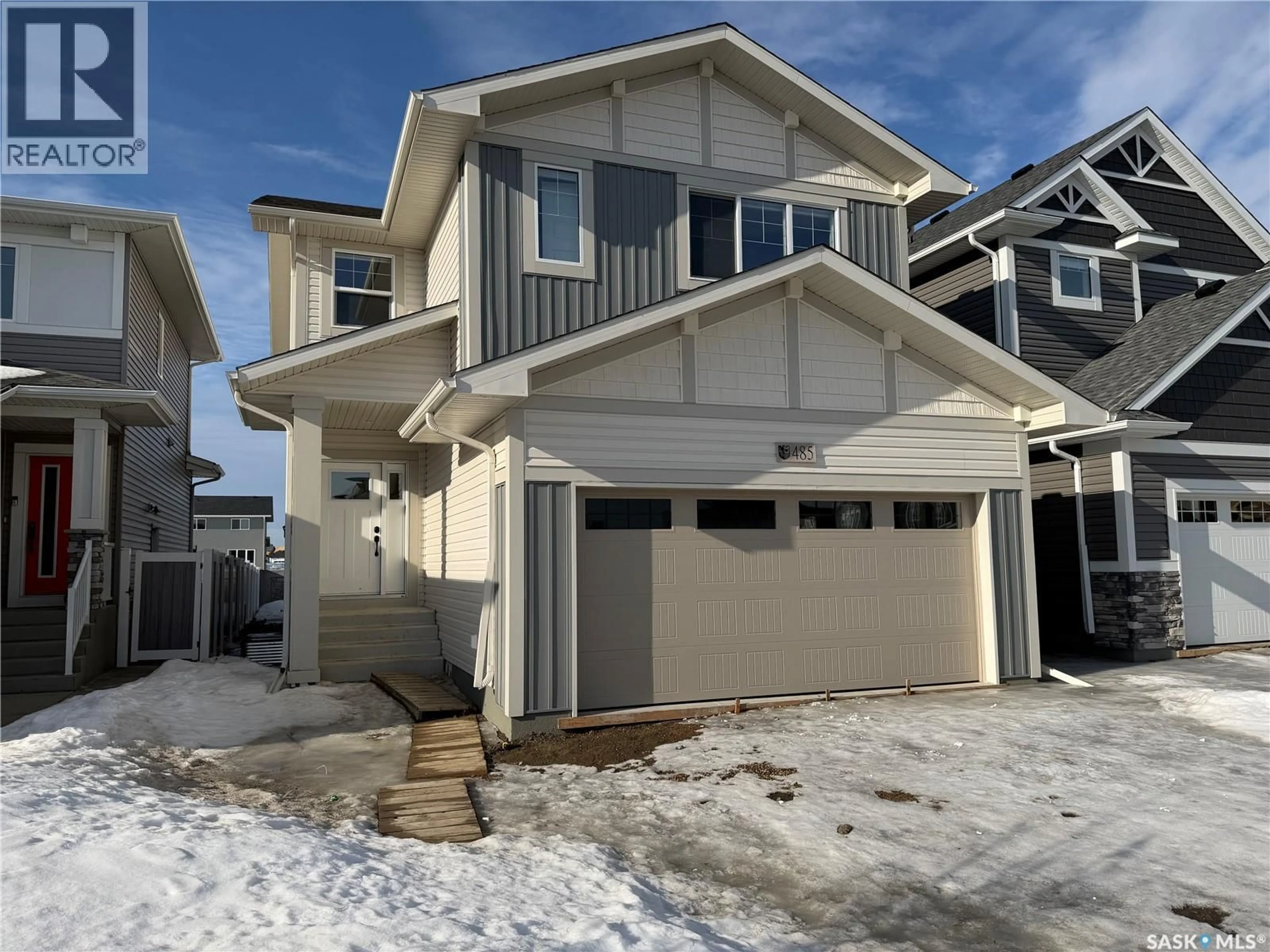 Home with vinyl exterior material, street for 406 LESKIW BEND, Saskatoon Saskatchewan S7V2A6