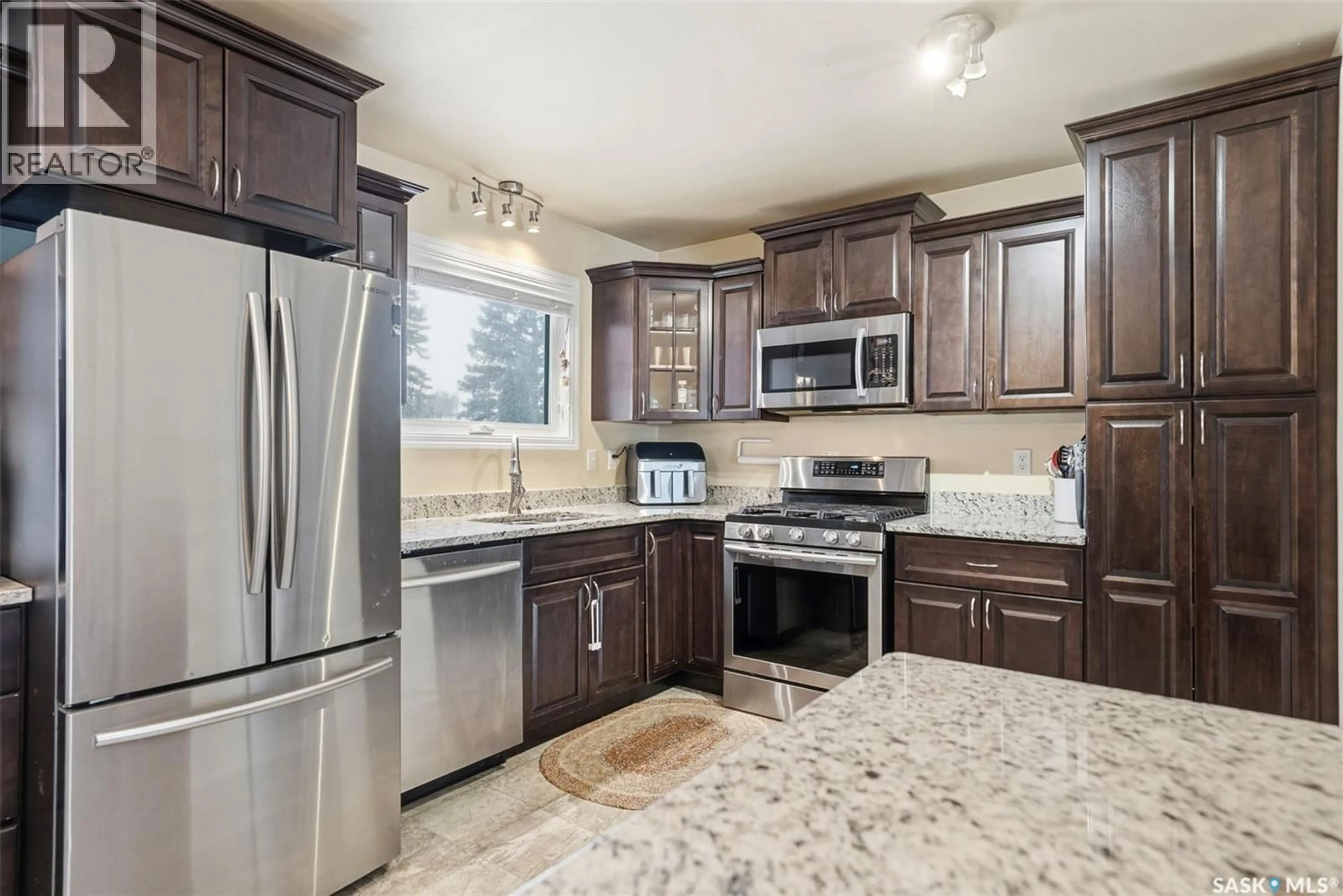 Open concept kitchen, ceramic/tile floor for 115 CYPRESS COURT, Saskatoon Saskatchewan S7K5C3