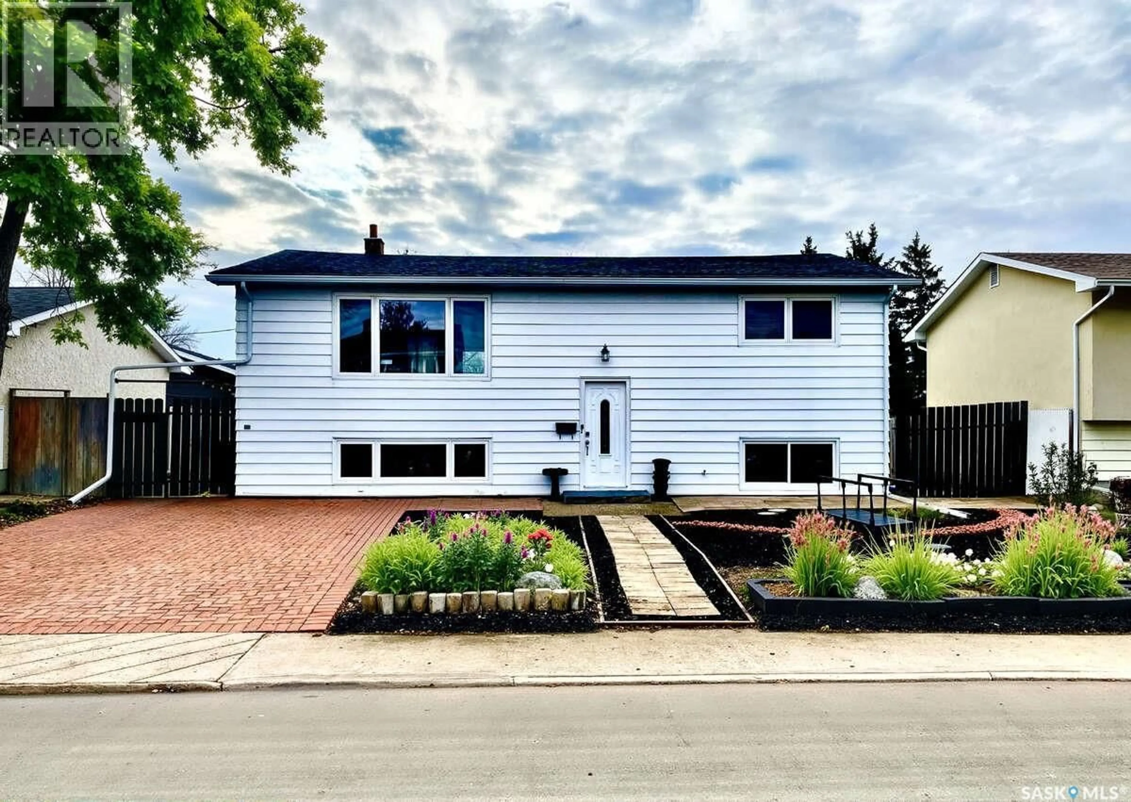 Home with vinyl exterior material, street for 7227 6TH AVENUE, Regina Saskatchewan S4T0P3