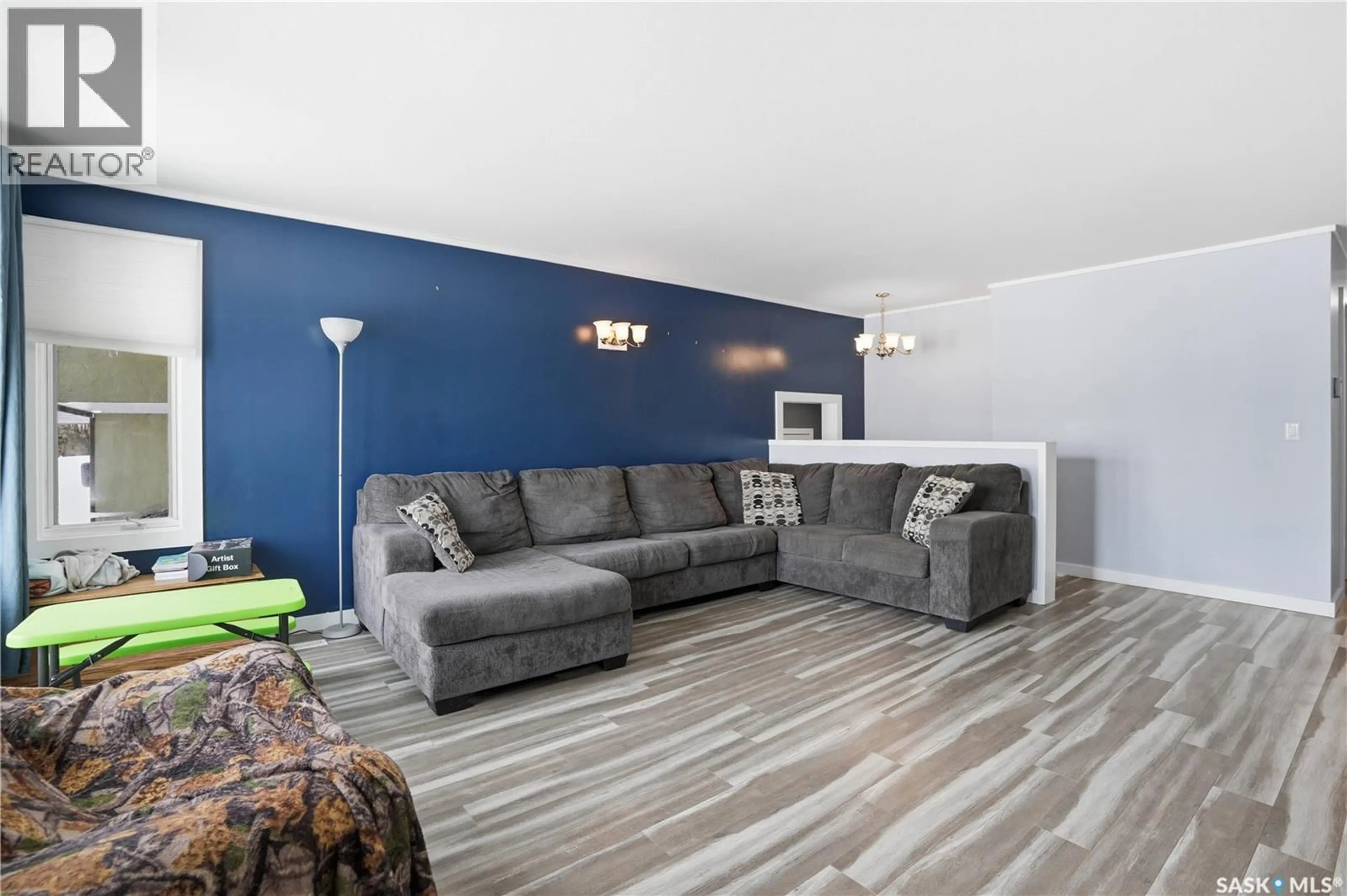 Living room with furniture, wood/laminate floor for 116 2ND STREET, Hague Saskatchewan S0K1X0