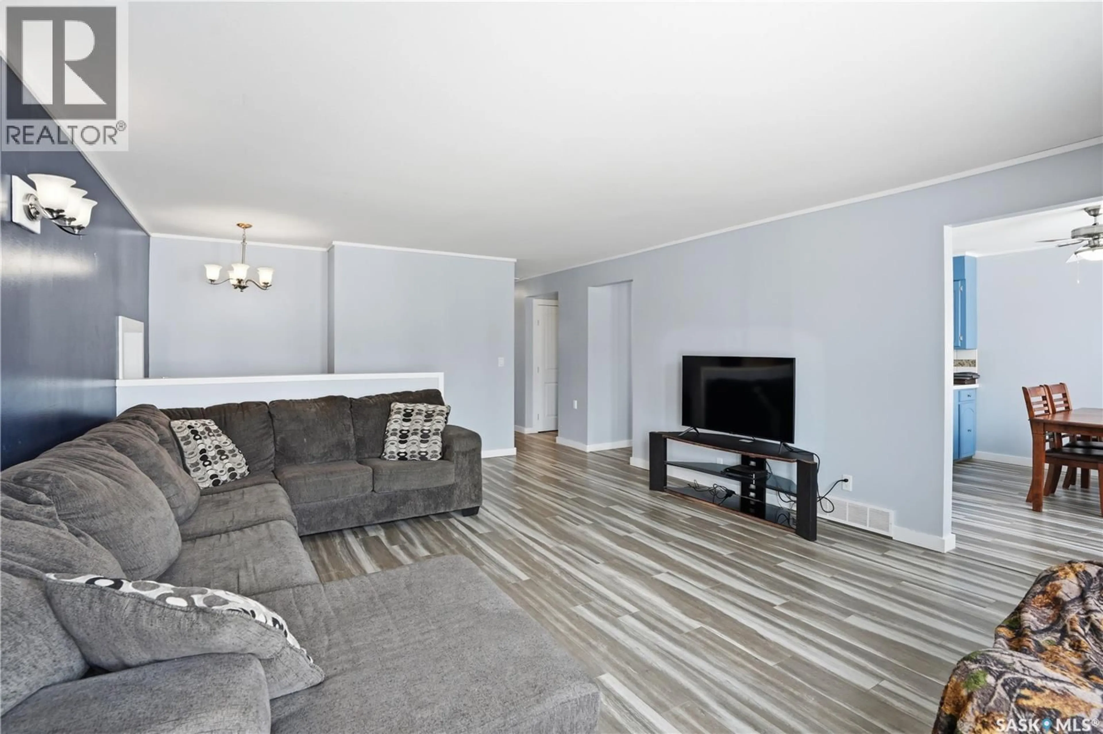 Living room with furniture, wood/laminate floor for 116 2ND STREET, Hague Saskatchewan S0K1X0