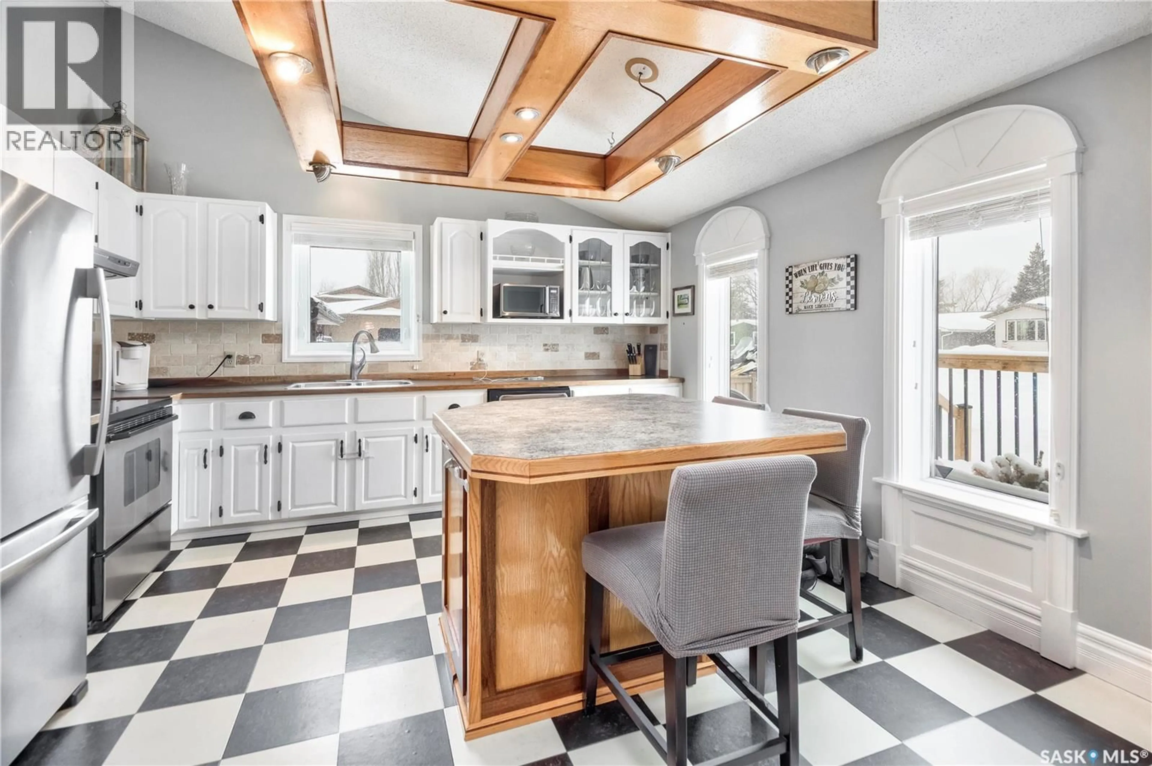 Open concept kitchen, ceramic/tile floor for 814 CARR PLACE, Prince Albert Saskatchewan S6V7E1