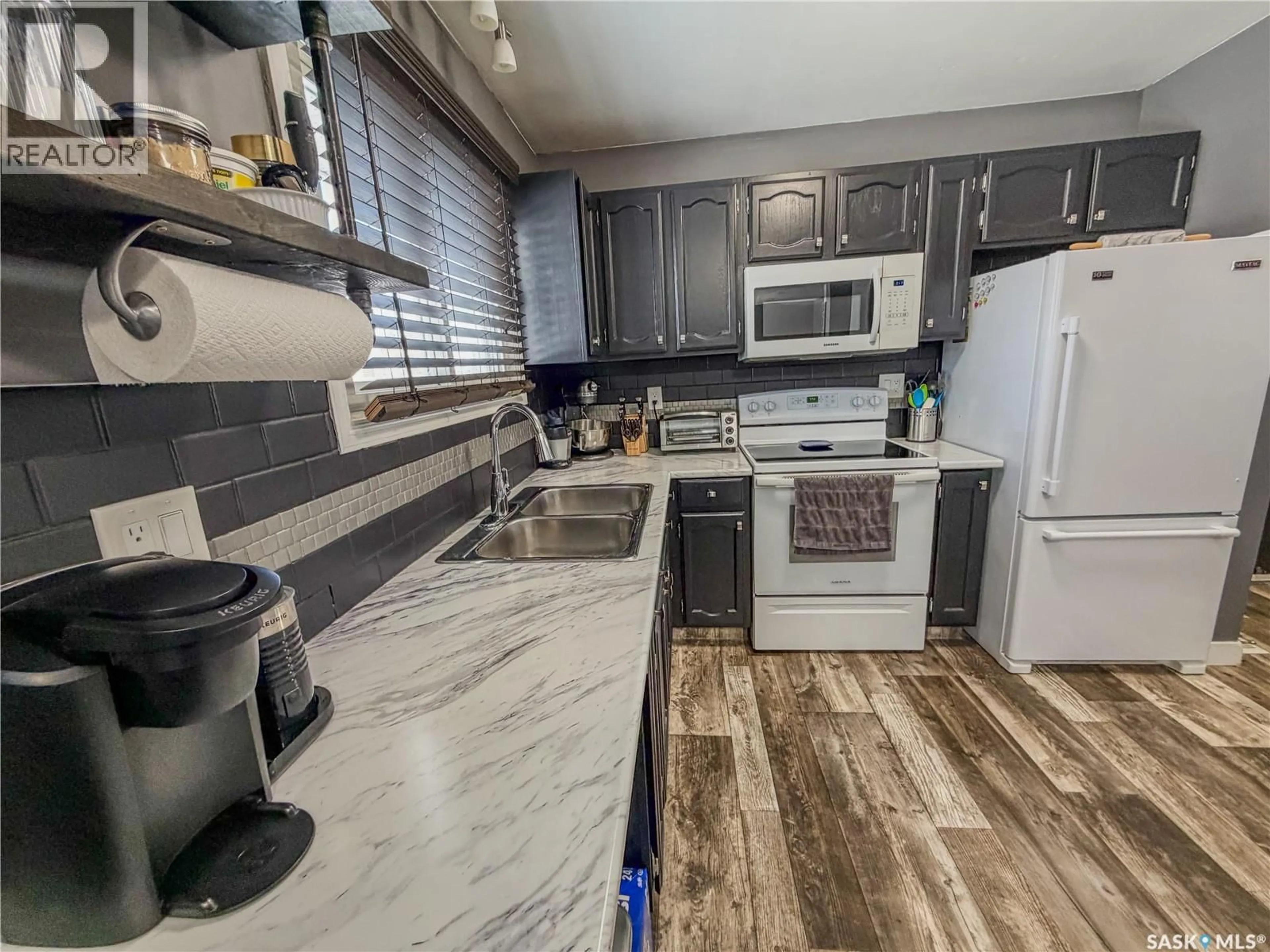 Open concept kitchen, ceramic/tile floor for 210 WELLS AVENUE, Langenburg Saskatchewan S0A2A0