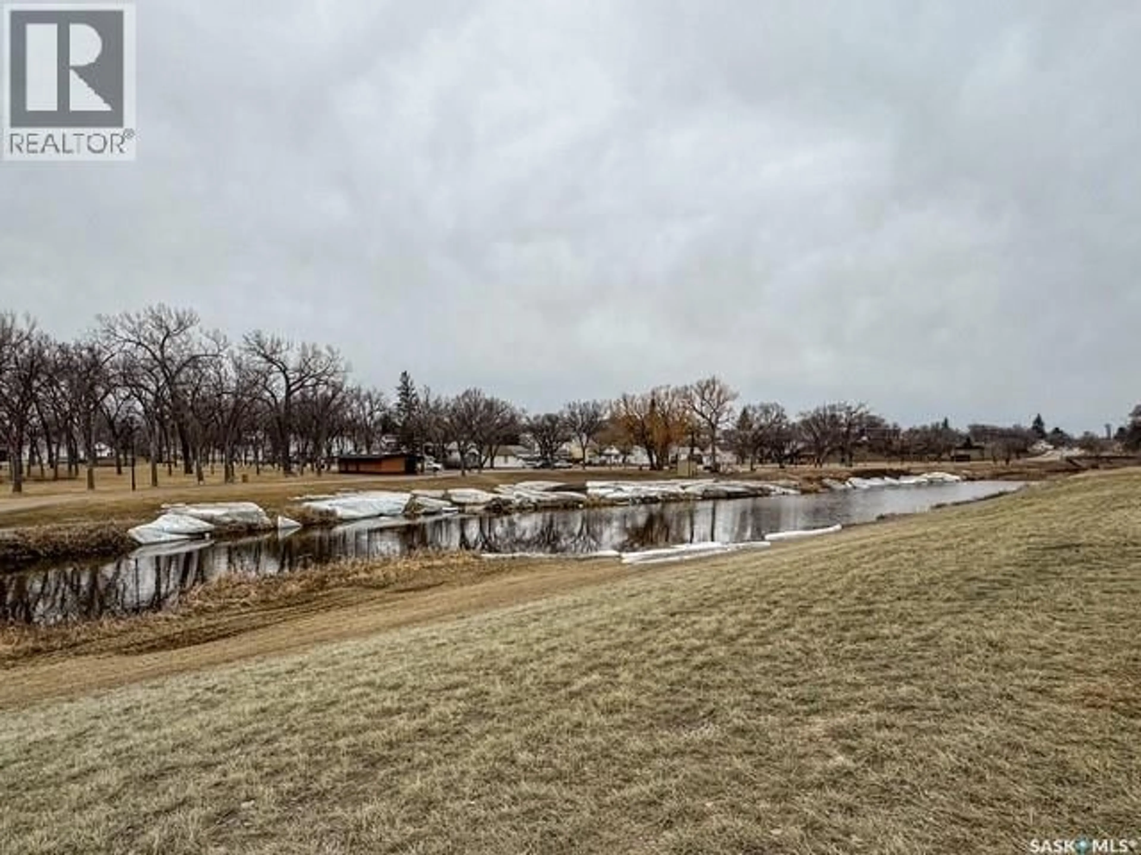 A pic from outside/outdoor area/front of a property/back of a property/a pic from drone, water/lake/river/ocean view for 947 & 957 CONNAUGHT DRIVE, Swift Current Saskatchewan S9H1R9