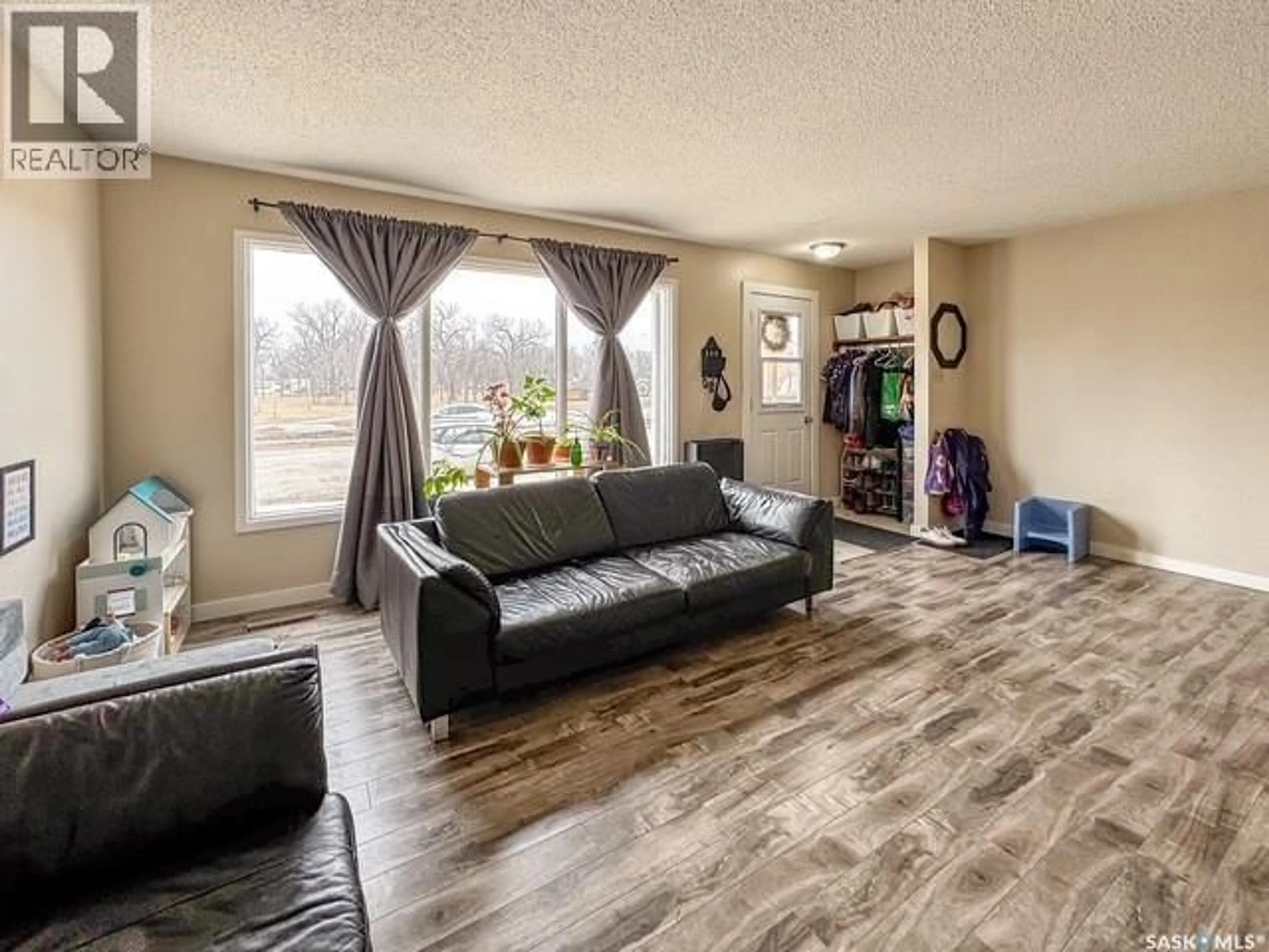 Living room with furniture, unknown for 947 & 957 CONNAUGHT DRIVE, Swift Current Saskatchewan S9H1R9