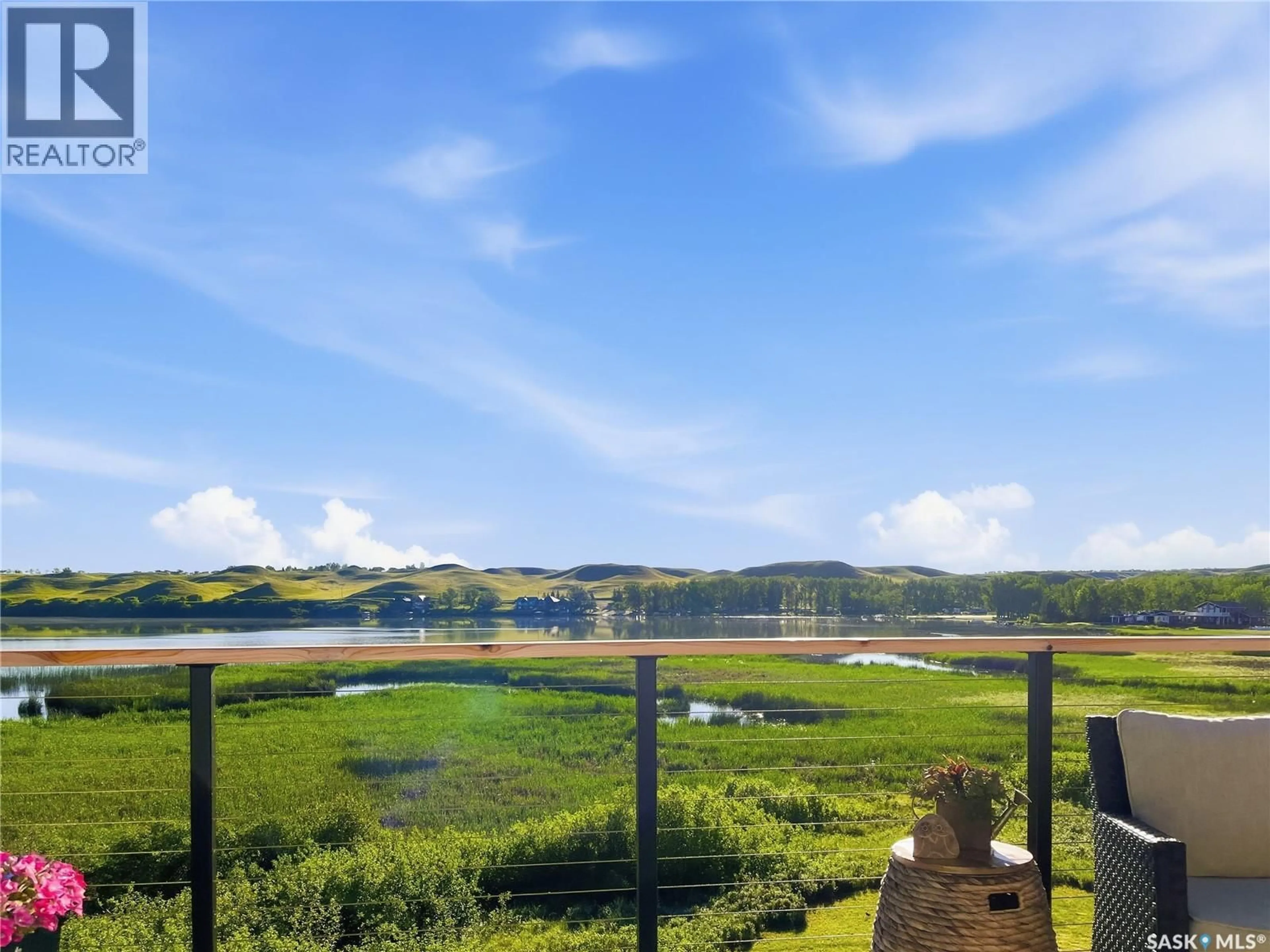 A pic from outside/outdoor area/front of a property/back of a property/a pic from drone, water/lake/river/ocean view for 214 HILLCREST PLACE, Lac Pelletier Rm No. 107 Saskatchewan S0N2Y0