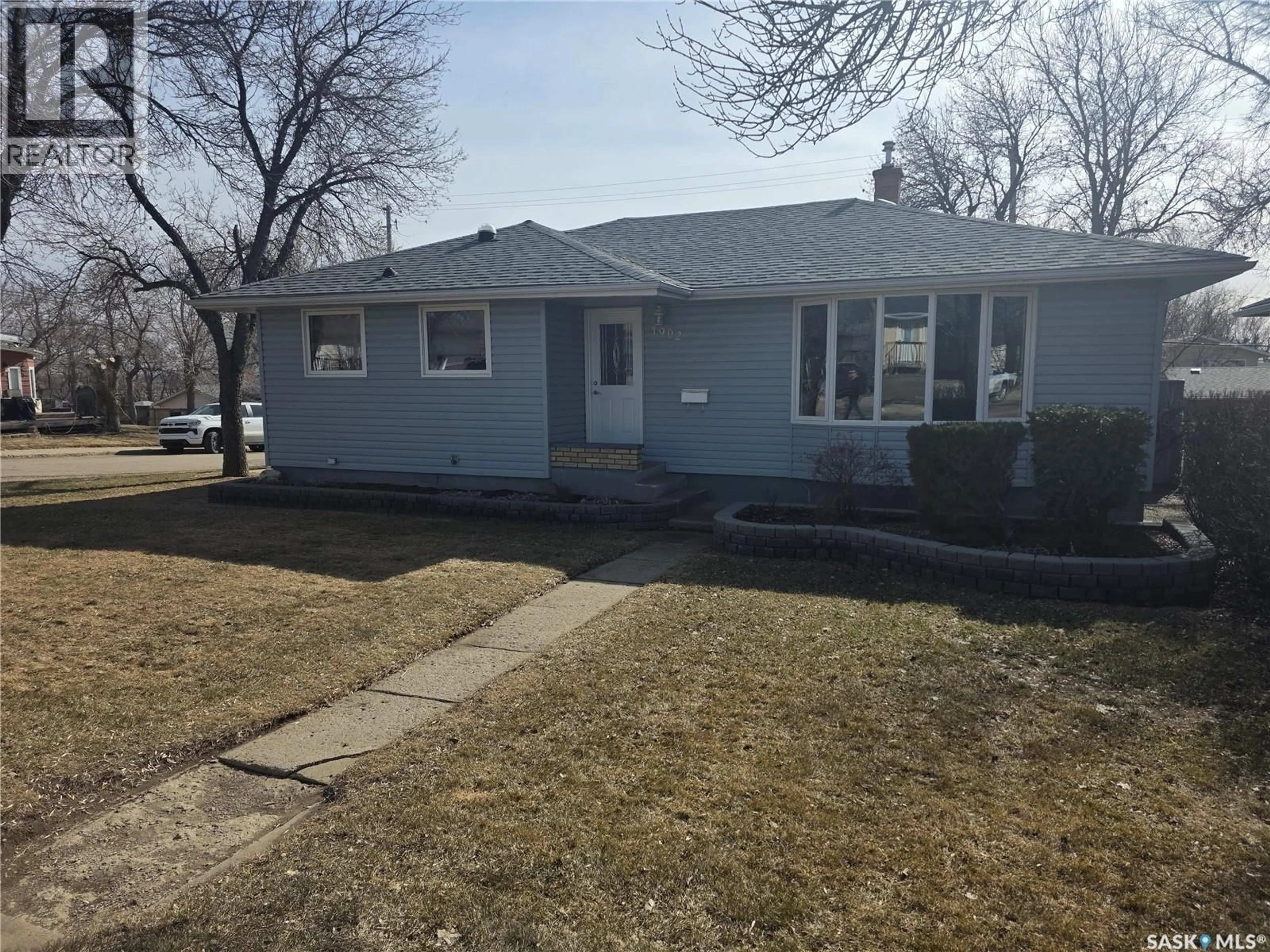 Home with vinyl exterior material, street for 1902 1ST STREET, Estevan Saskatchewan S4A0J1