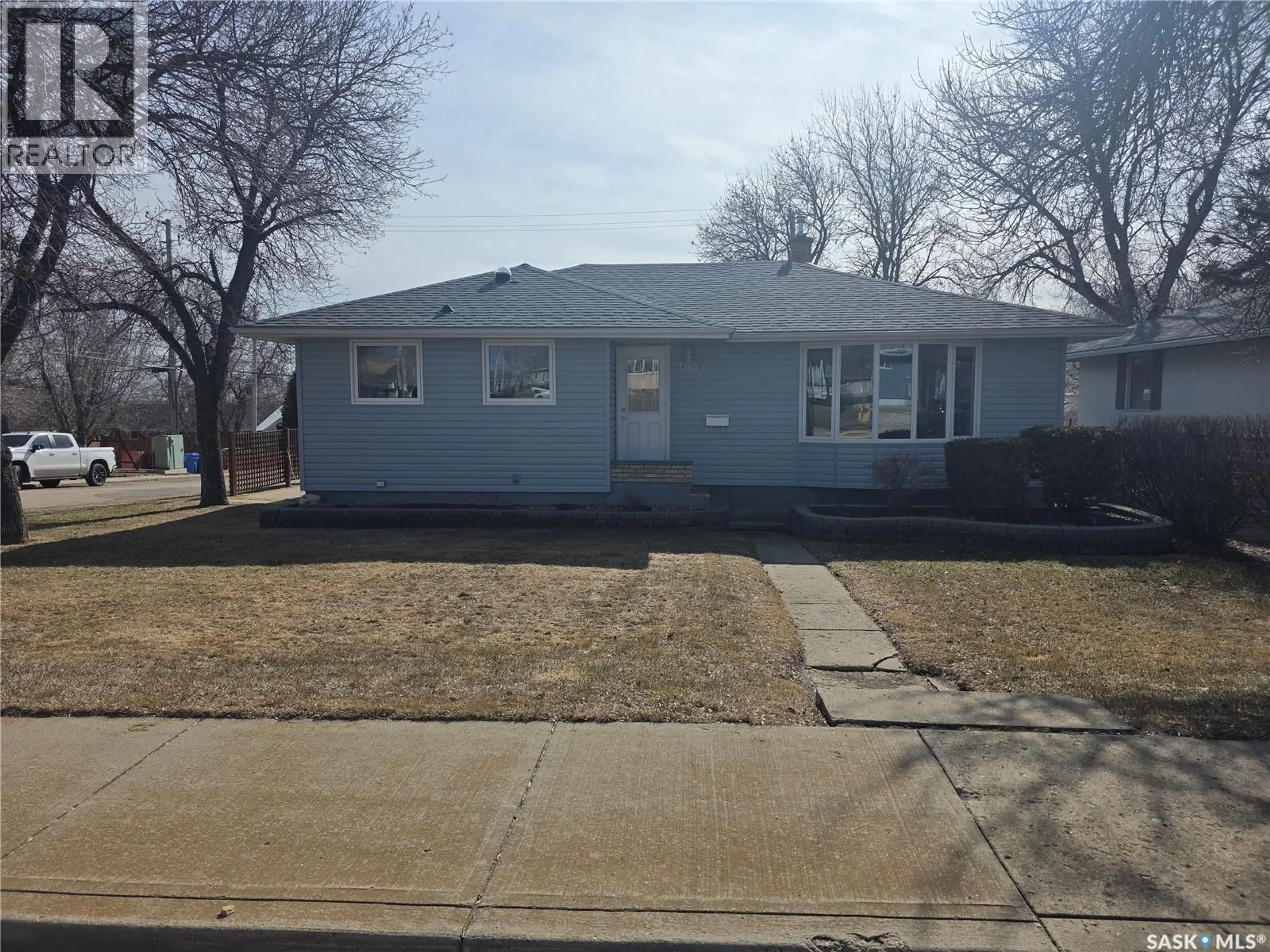 Home with vinyl exterior material, street for 1902 1ST STREET, Estevan Saskatchewan S4A0J1