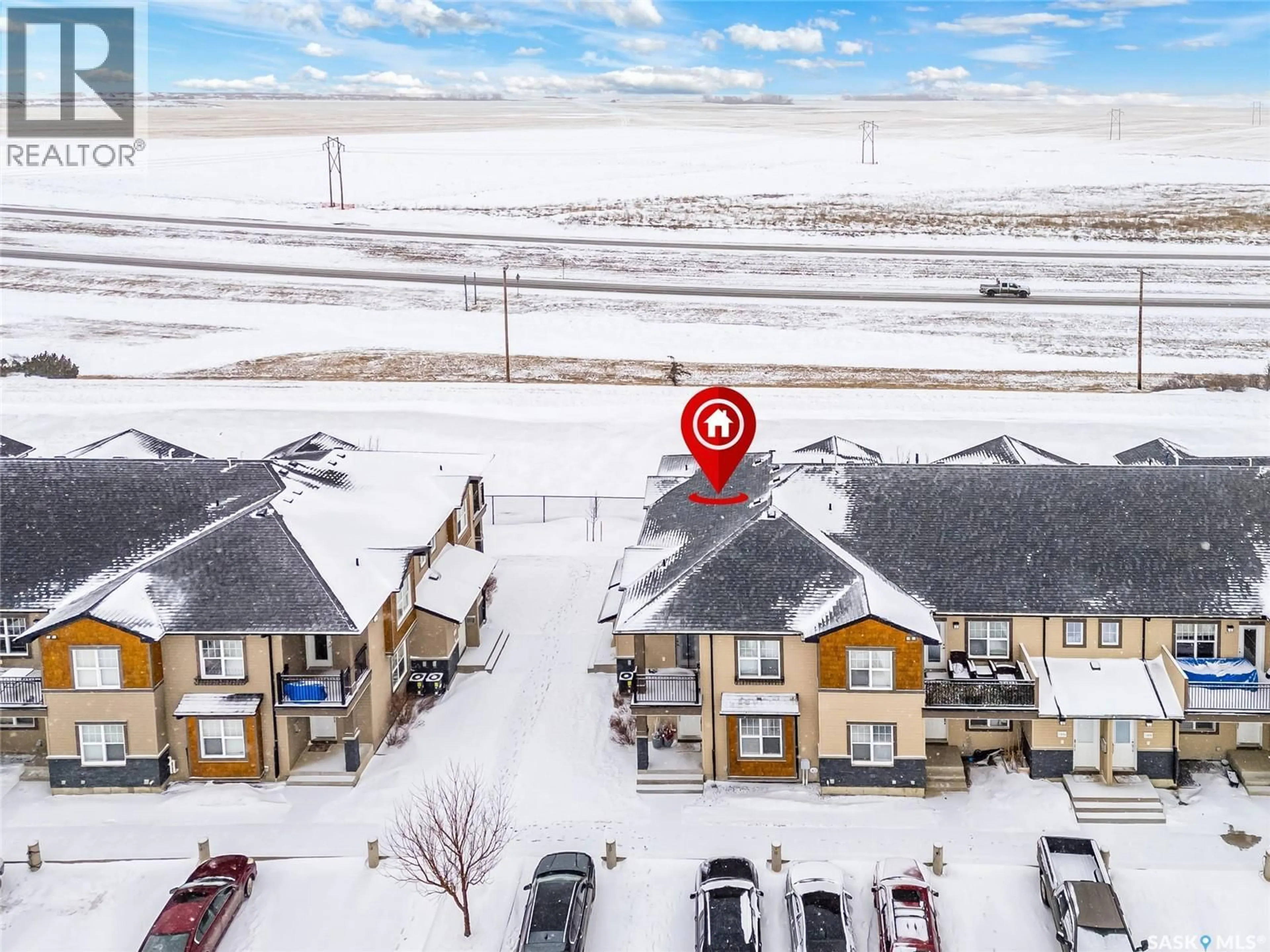 A pic from outside/outdoor area/front of a property/back of a property/a pic from drone, street for 1015 - 1102 PATRICK CRESCENT, Saskatoon Saskatchewan S7W0M4