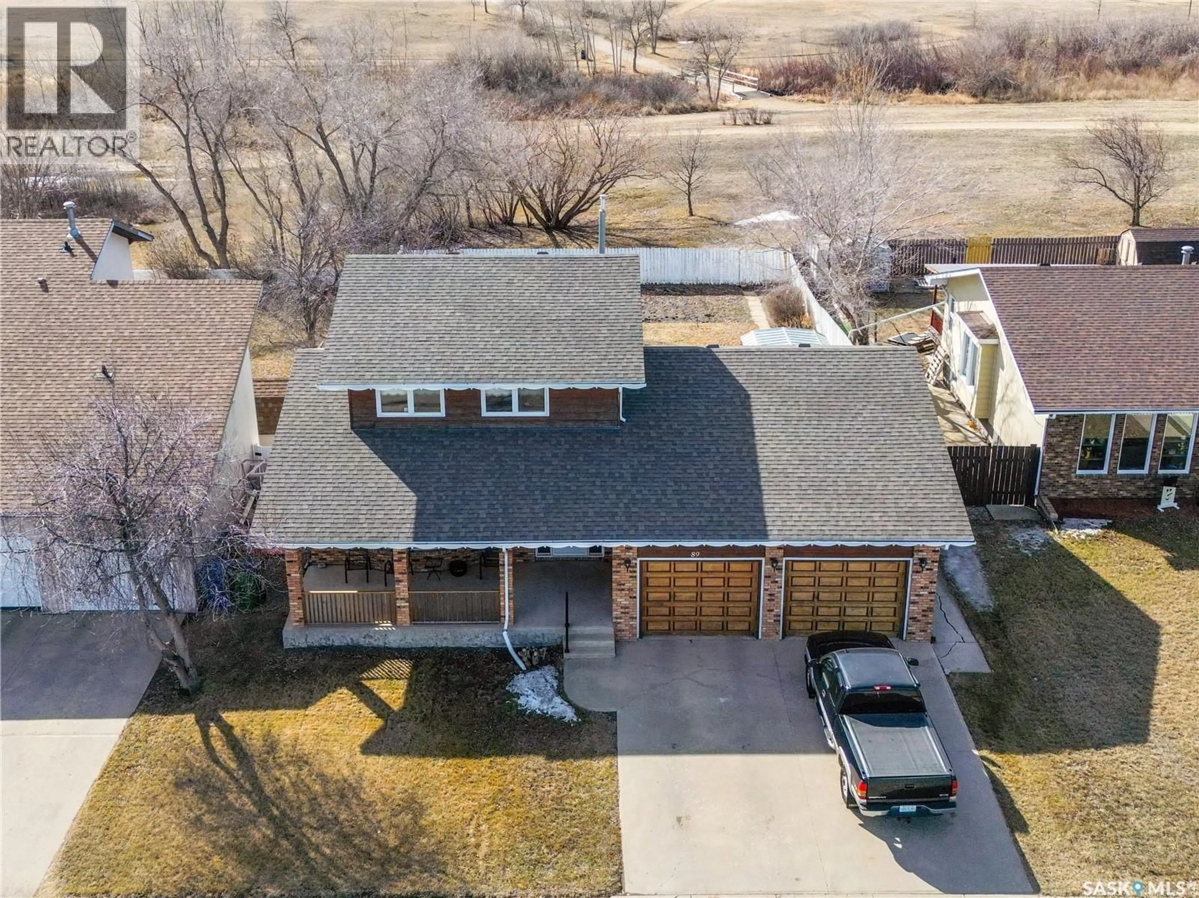 A pic from outside/outdoor area/front of a property/back of a property/a pic from drone, street for 89 CALYPSO DRIVE, Moose Jaw Saskatchewan S6J1G1