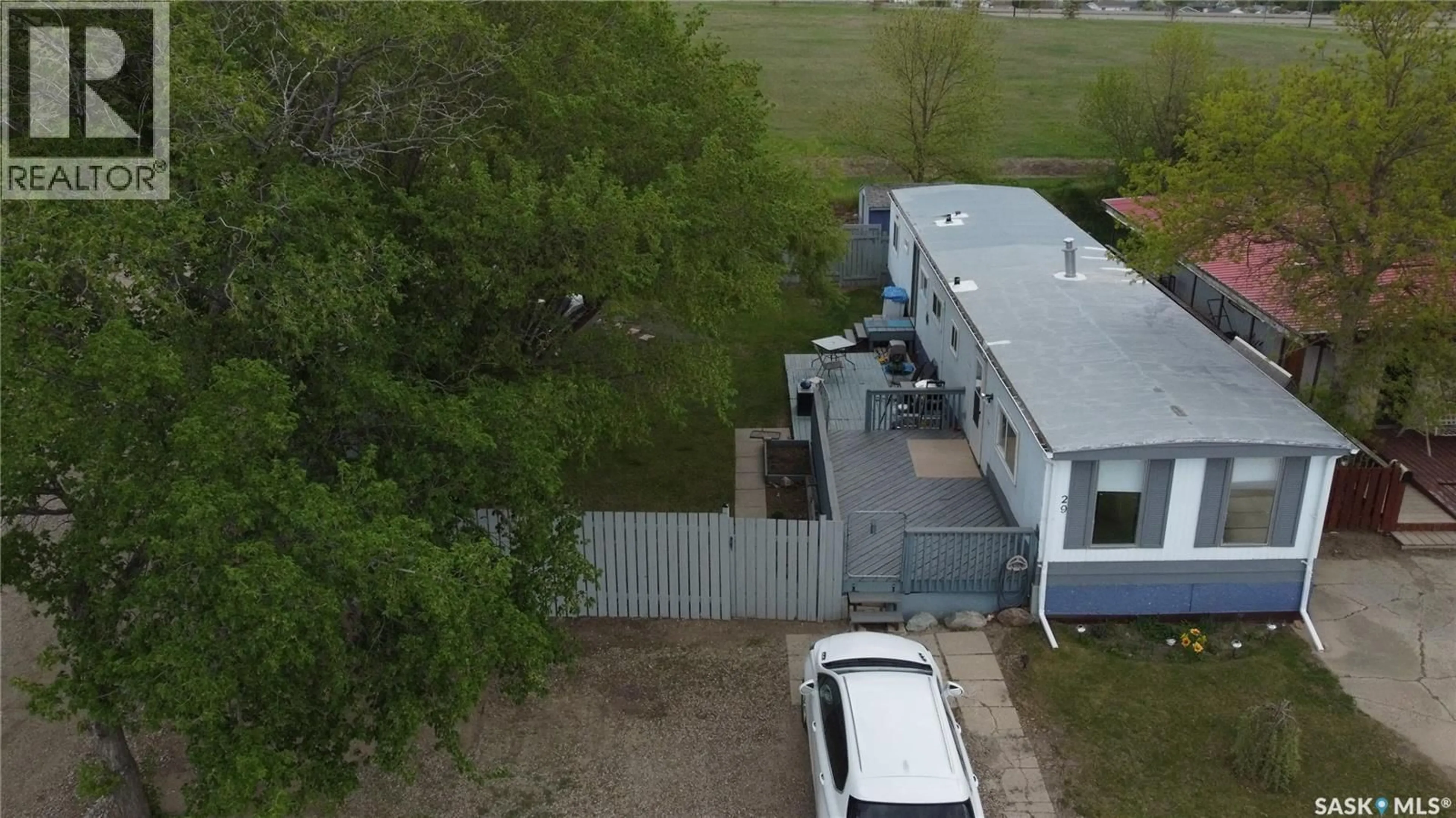 A pic from outside/outdoor area/front of a property/back of a property/a pic from drone, street for 29 701 11TH AVENUE, Swift Current Saskatchewan S9H4M5