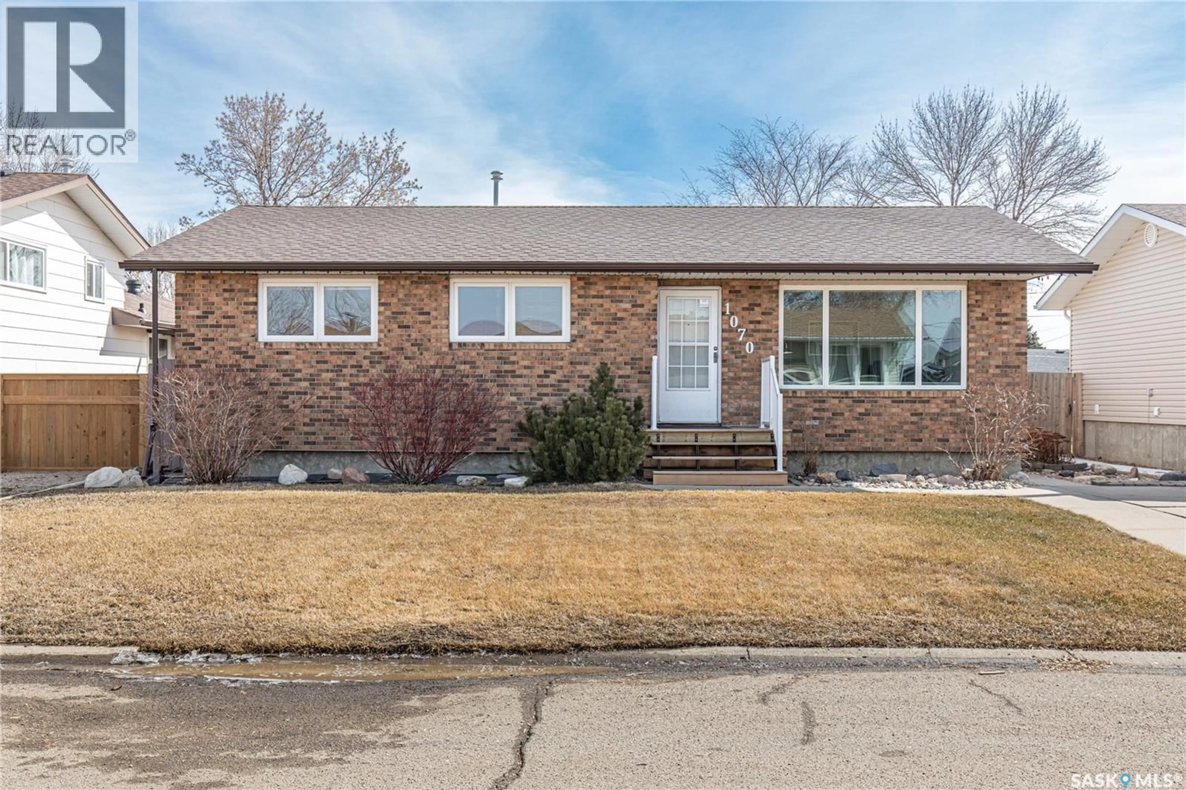 Home with brick exterior material, street for 1070 CORMAN CRESCENT, Moose Jaw Saskatchewan S6H6W1