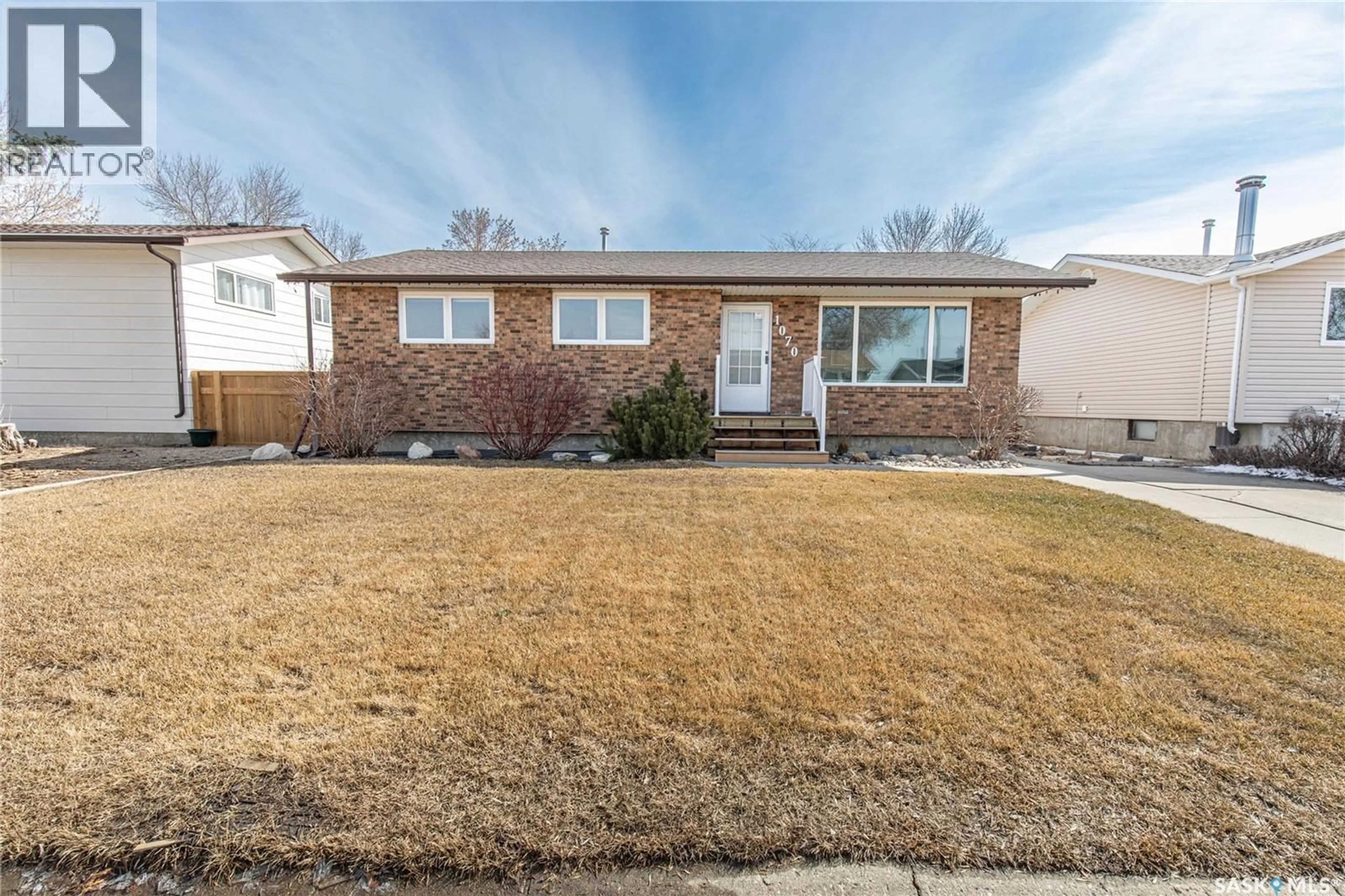 Home with brick exterior material, street for 1070 CORMAN CRESCENT, Moose Jaw Saskatchewan S6H6W1