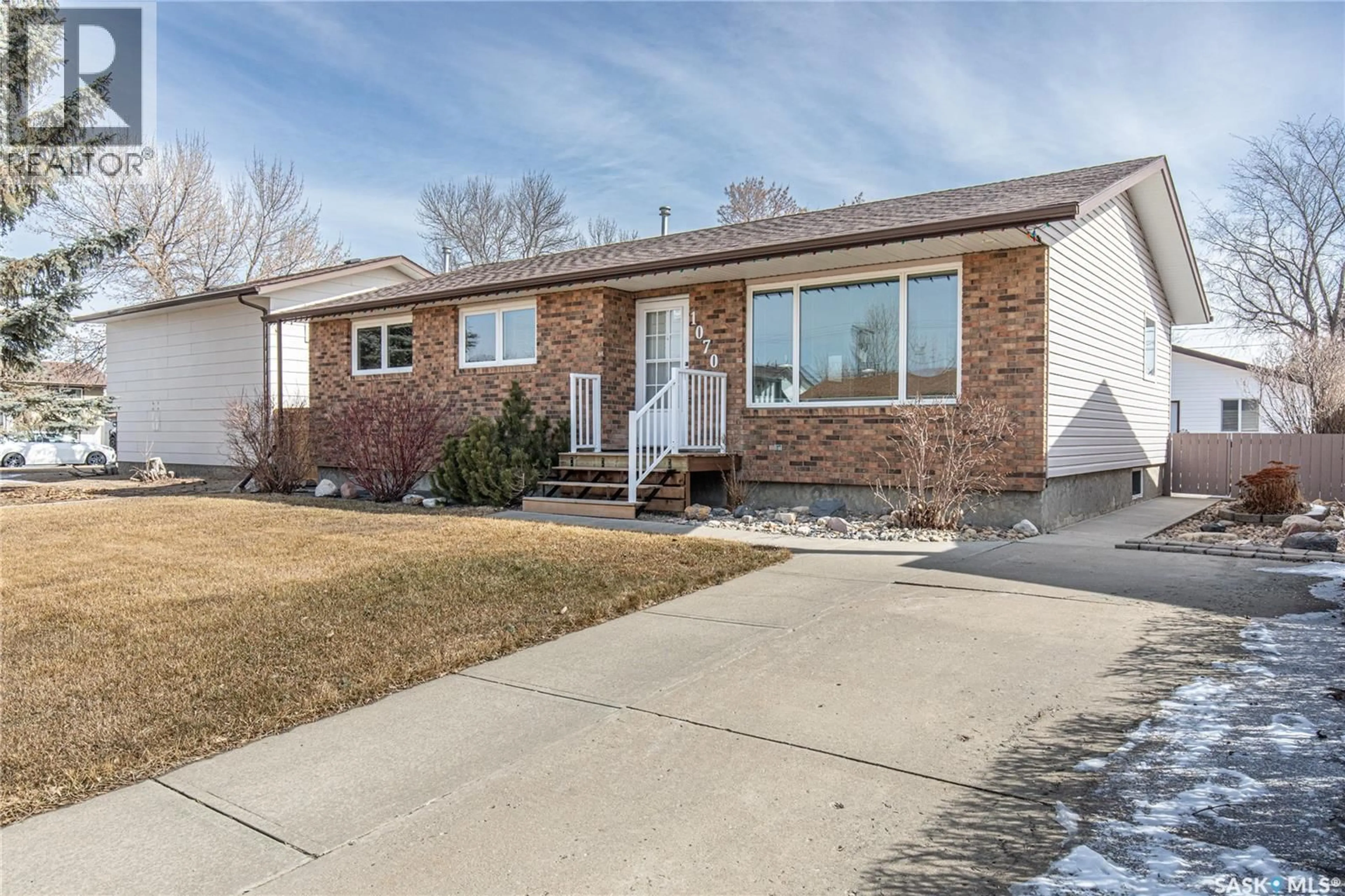 Home with brick exterior material, street for 1070 CORMAN CRESCENT, Moose Jaw Saskatchewan S6H6W1