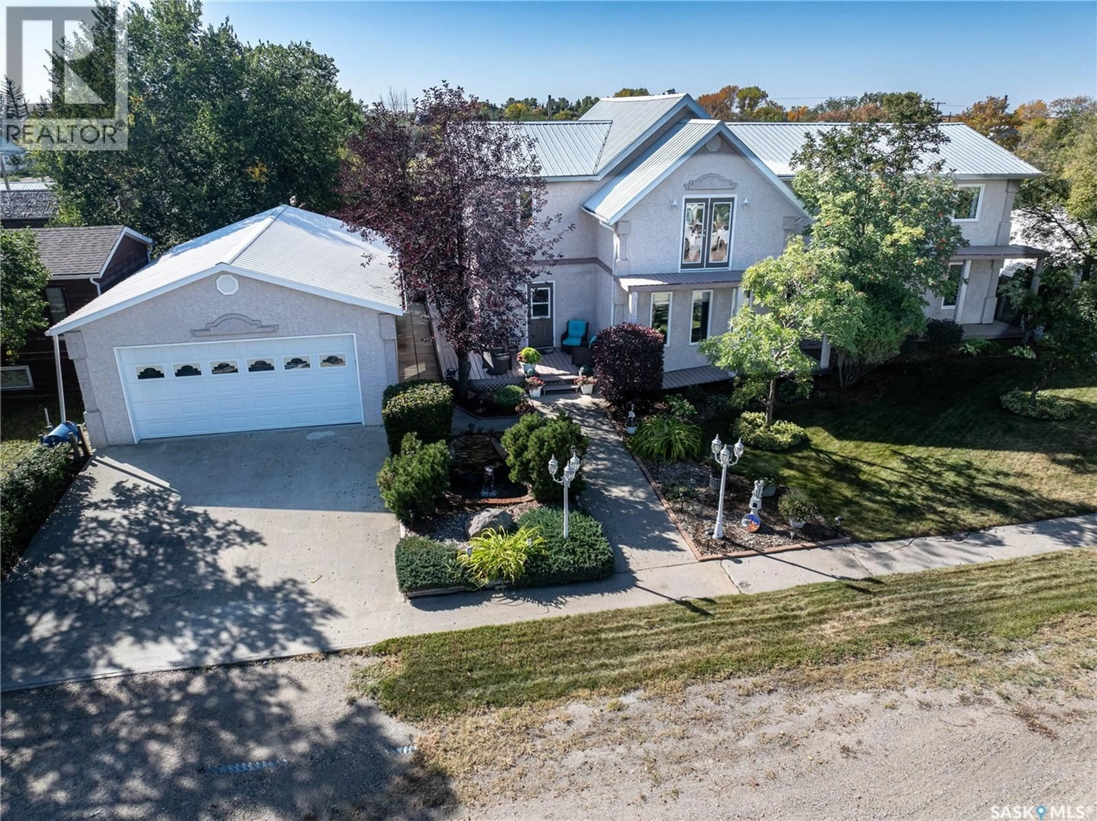 A pic from outside/outdoor area/front of a property/back of a property/a pic from drone, street for 304 1ST STREET, Milden Saskatchewan S0L2L0