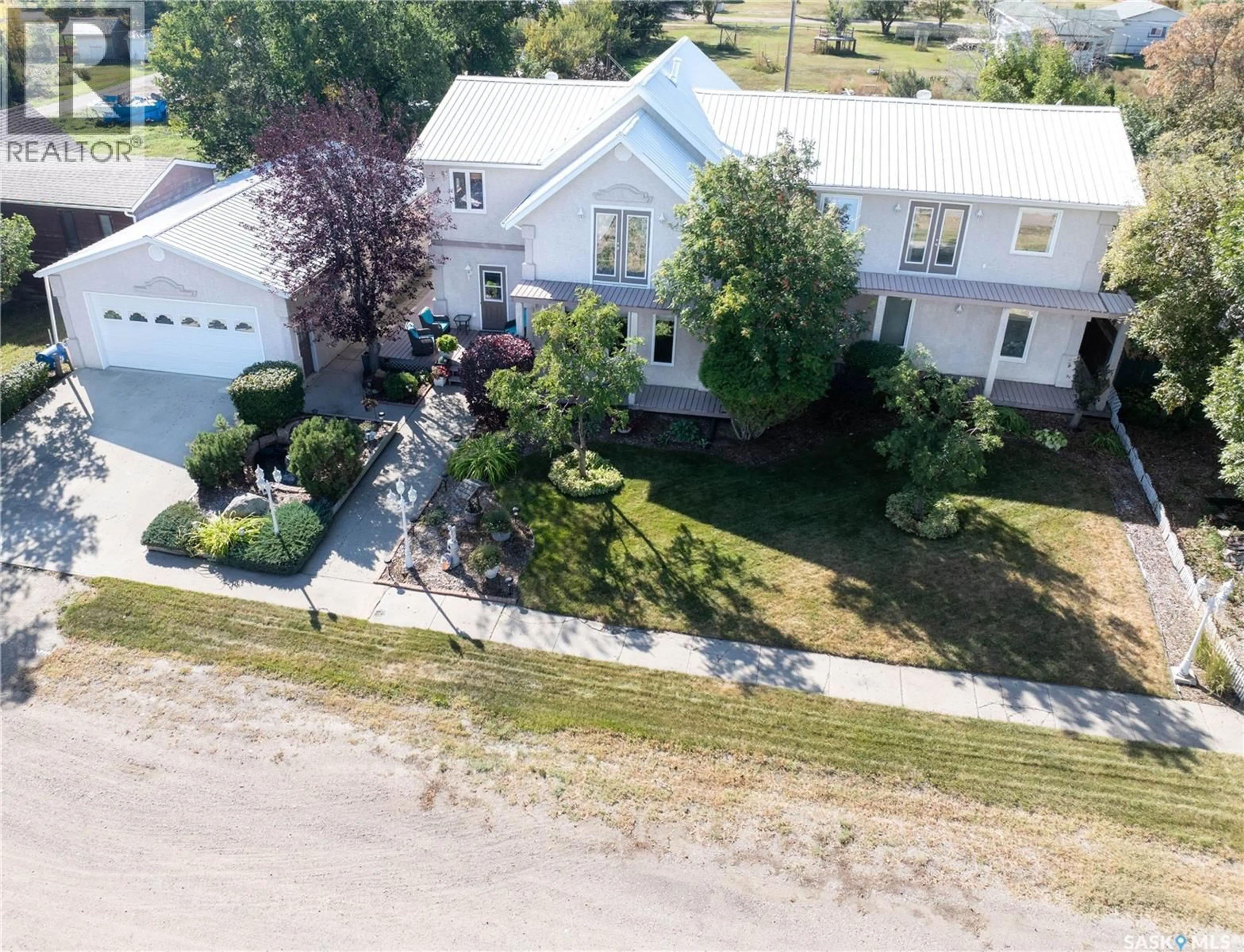 A pic from outside/outdoor area/front of a property/back of a property/a pic from drone, street for 304 1ST STREET, Milden Saskatchewan S0L2L0