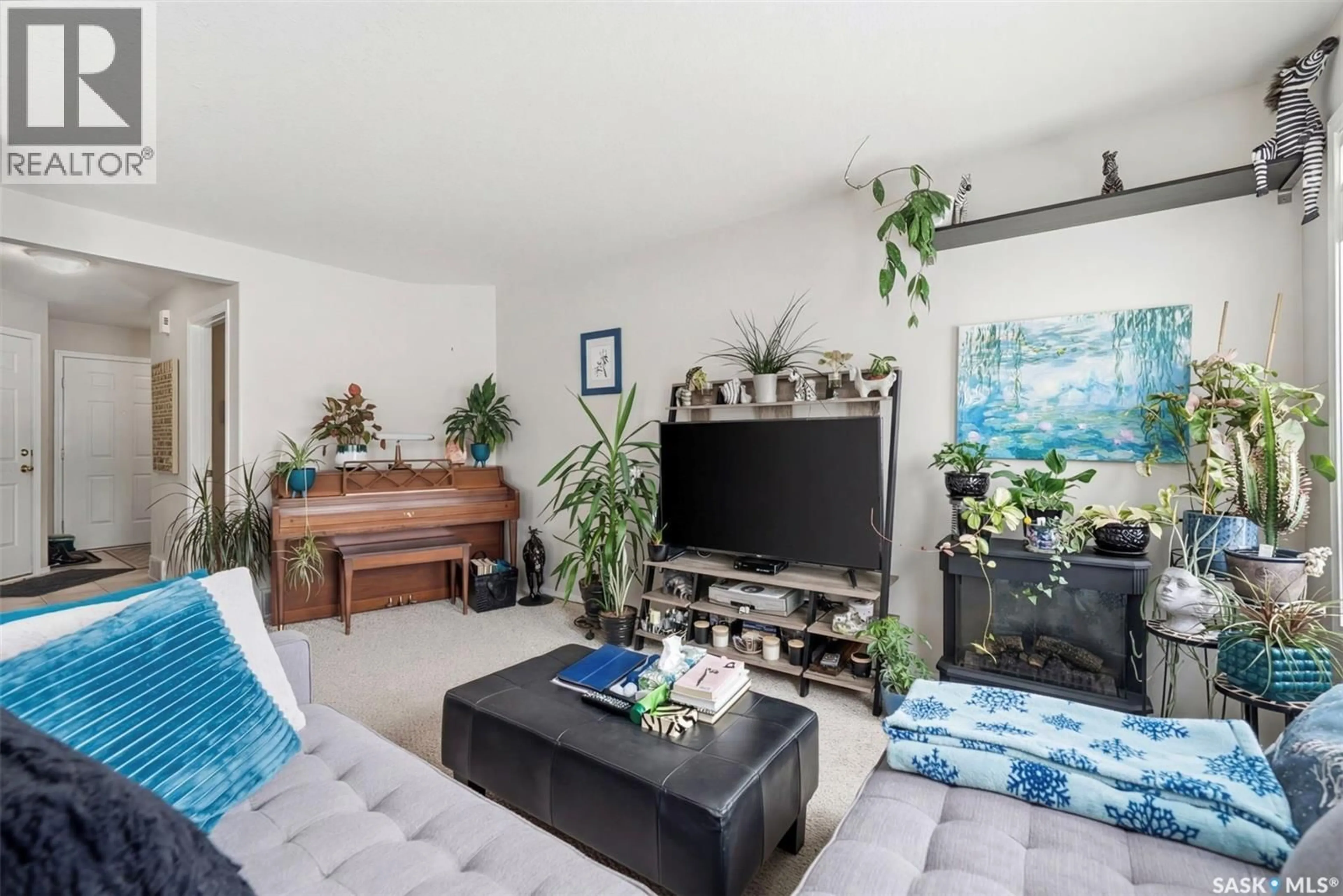 Living room with furniture, unknown for 15 111 FAIRBROTHER CRESCENT, Saskatoon Saskatchewan S7S1L3