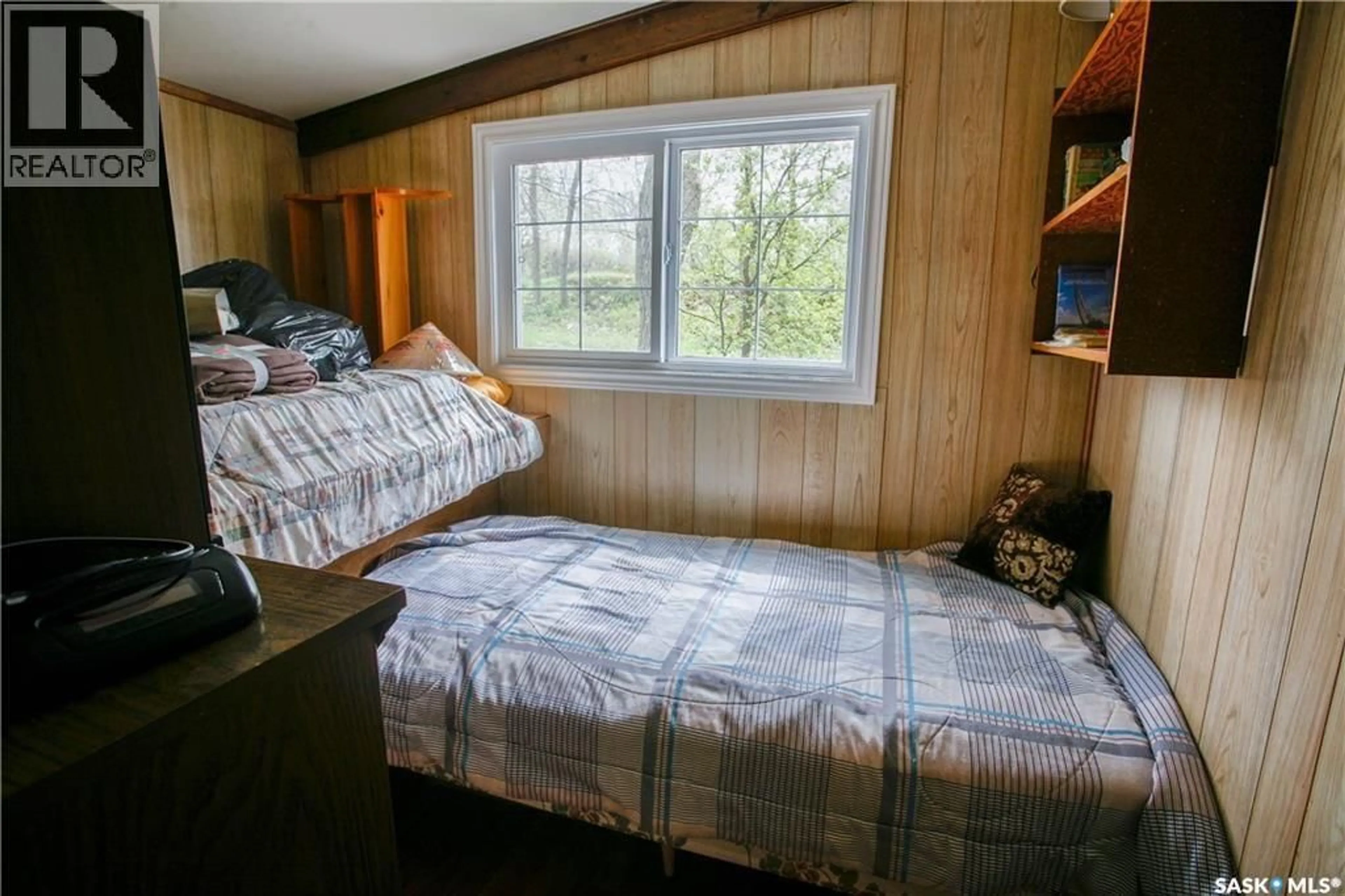 Bedroom with bed, wood/laminate floor for 424 LAST MOUNTAIN ROAD, Mckillop Rm No. 220 Saskatchewan S0G4L0