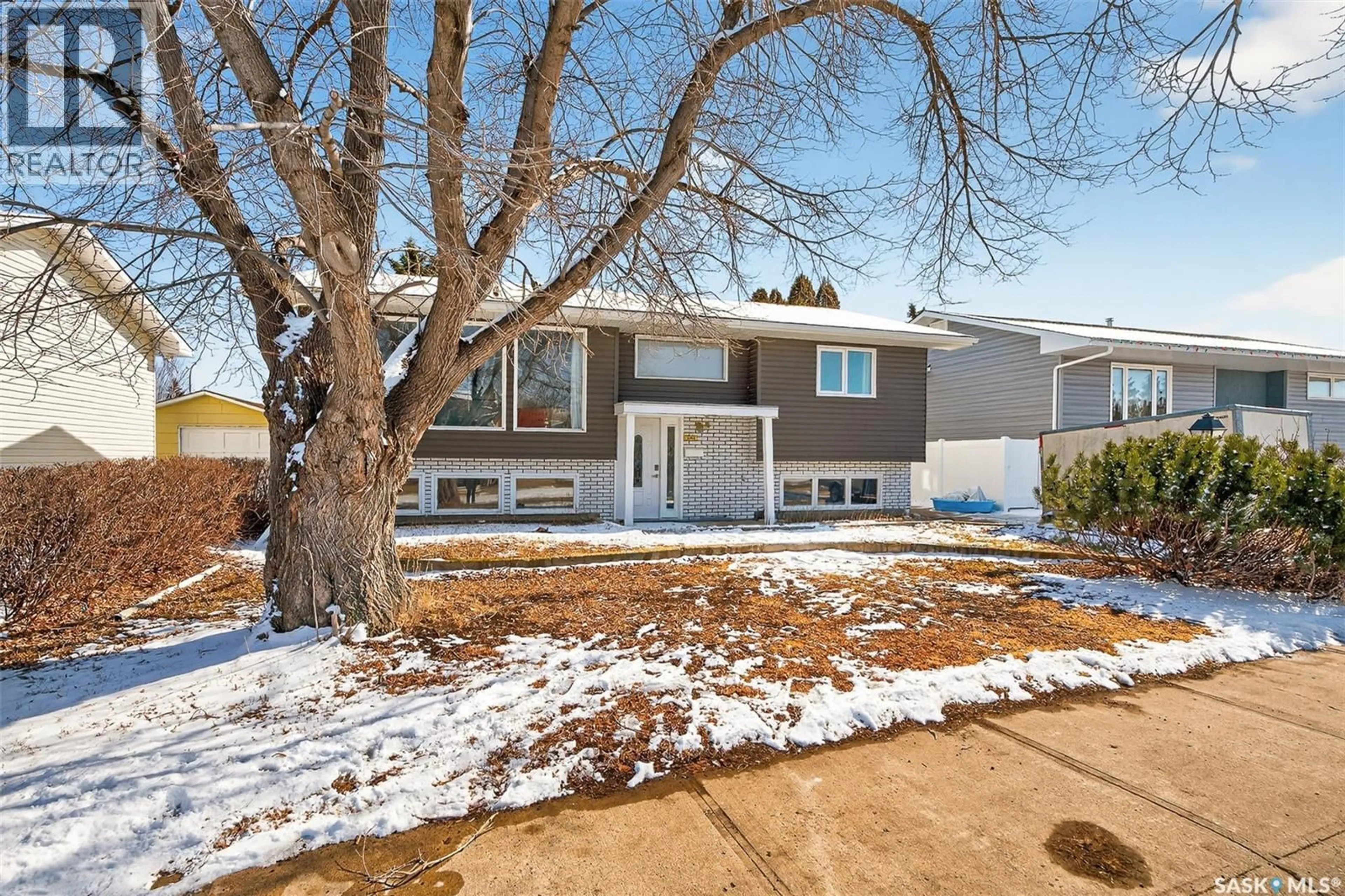 Home with vinyl exterior material, street for 1321 PRINCE CRESCENT, Moose Jaw Saskatchewan S6H6E6