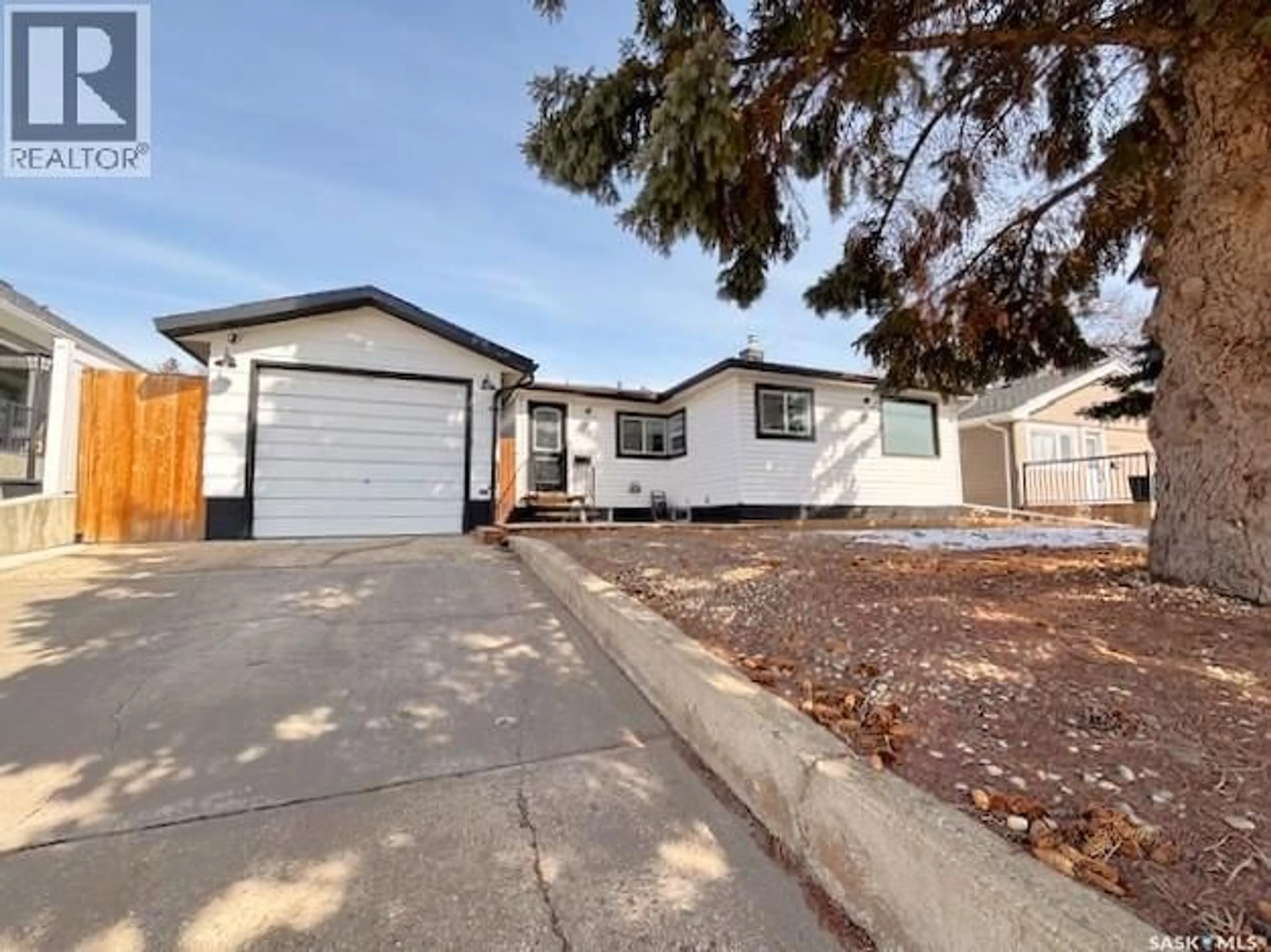 Home with vinyl exterior material, street for 1126 STADACONA STREET, Moose Jaw Saskatchewan S6H2B3