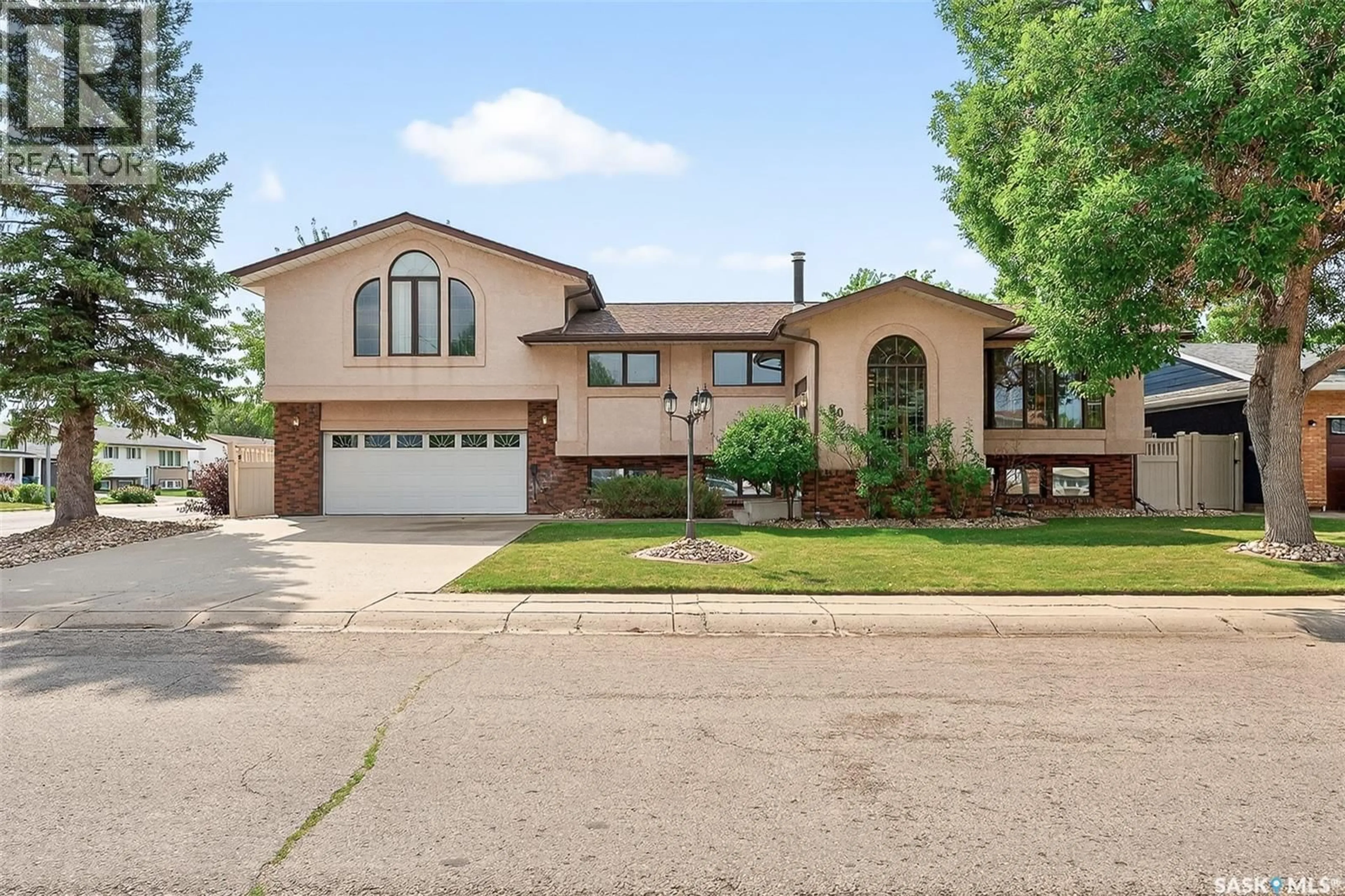 Home with brick exterior material, street for 80 BLUEBELL CRESCENT, Moose Jaw Saskatchewan S6J1A2