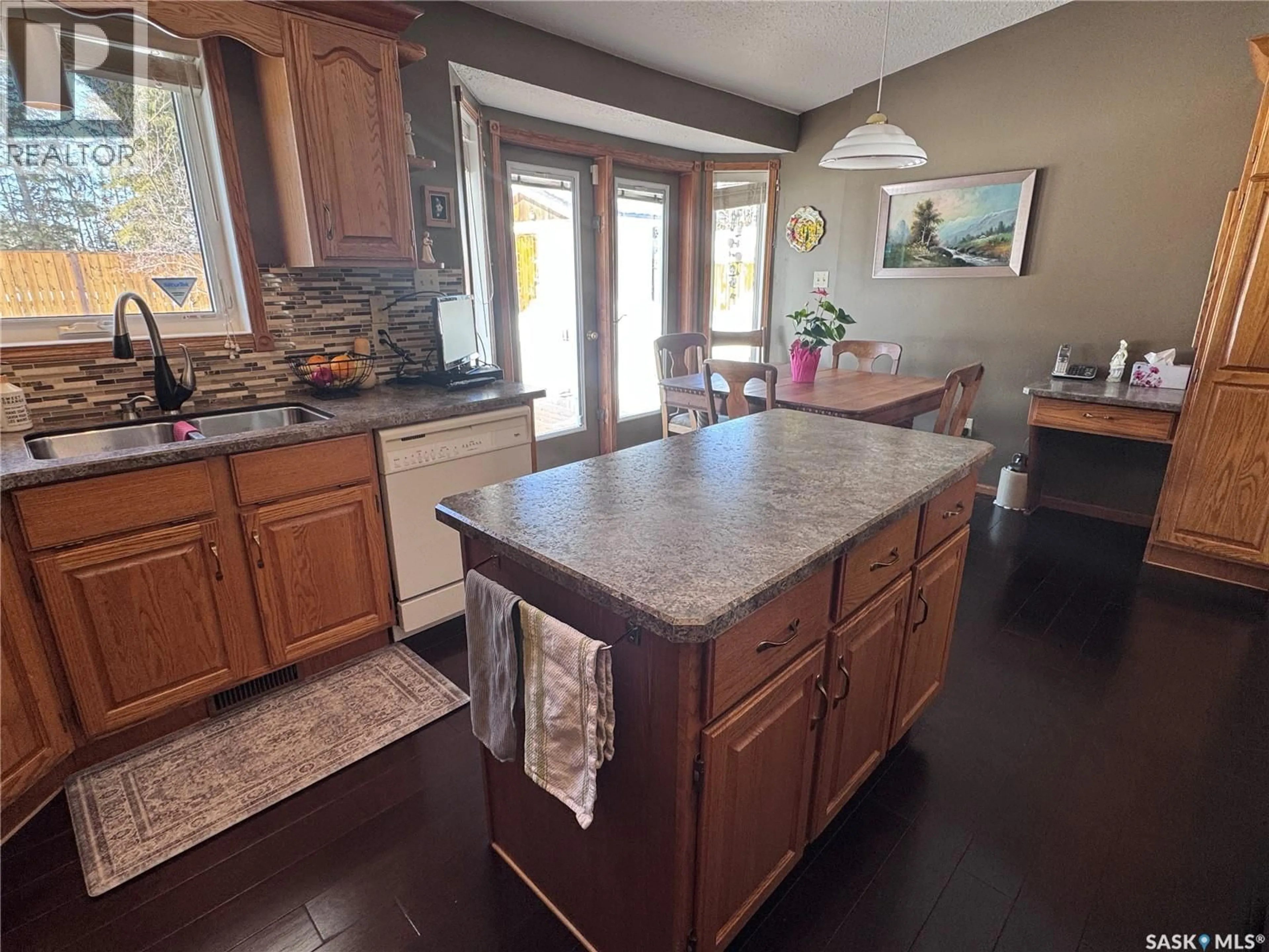 Open concept kitchen, ceramic/tile floor for 930 SINOTTE CRESCENT, La Ronge Saskatchewan S0J1L0