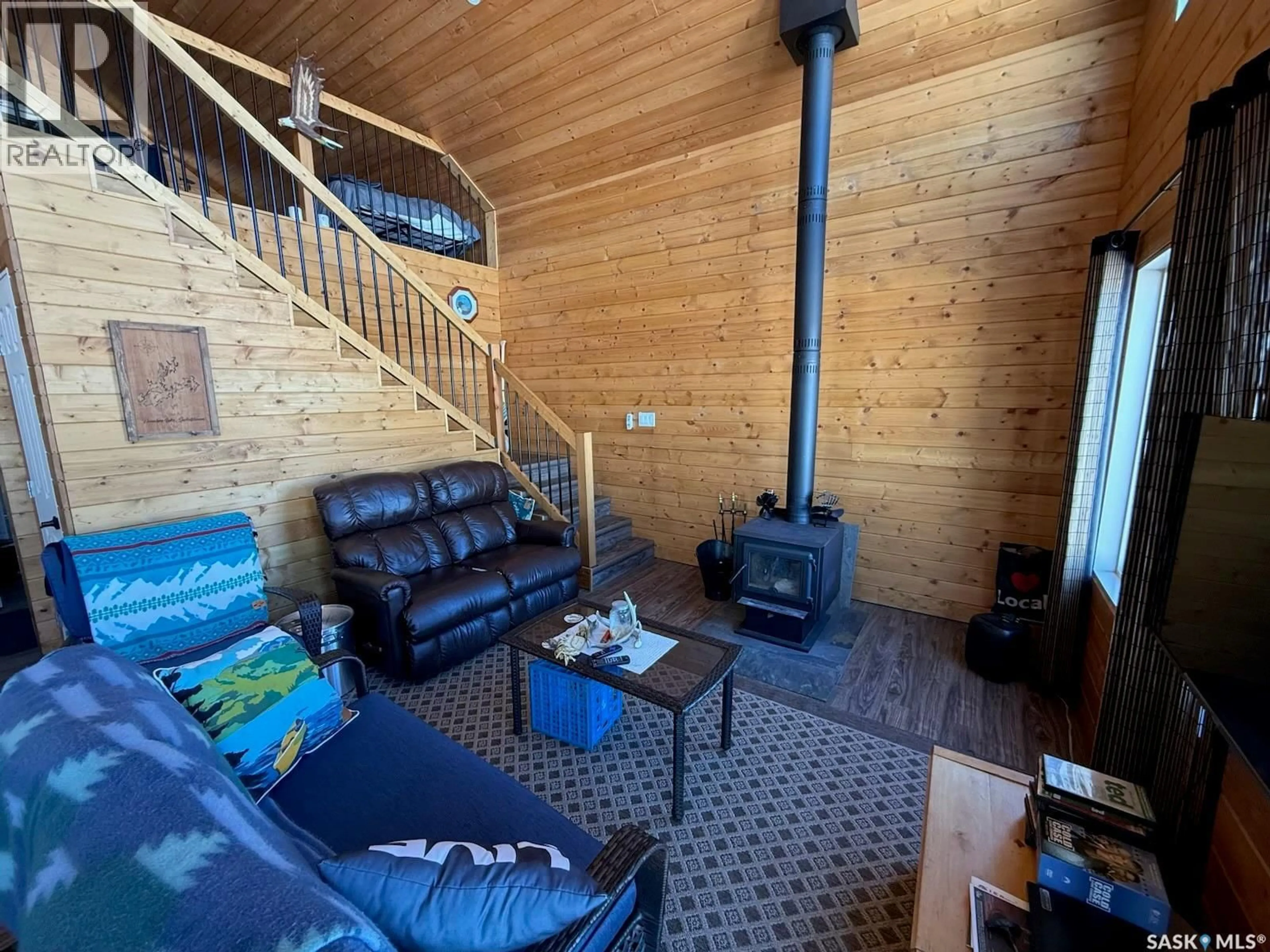 Living room with furniture, wood/laminate floor for CABIN IN REYNOLDS BAY, Northern Admin District Saskatchewan S0J1L0