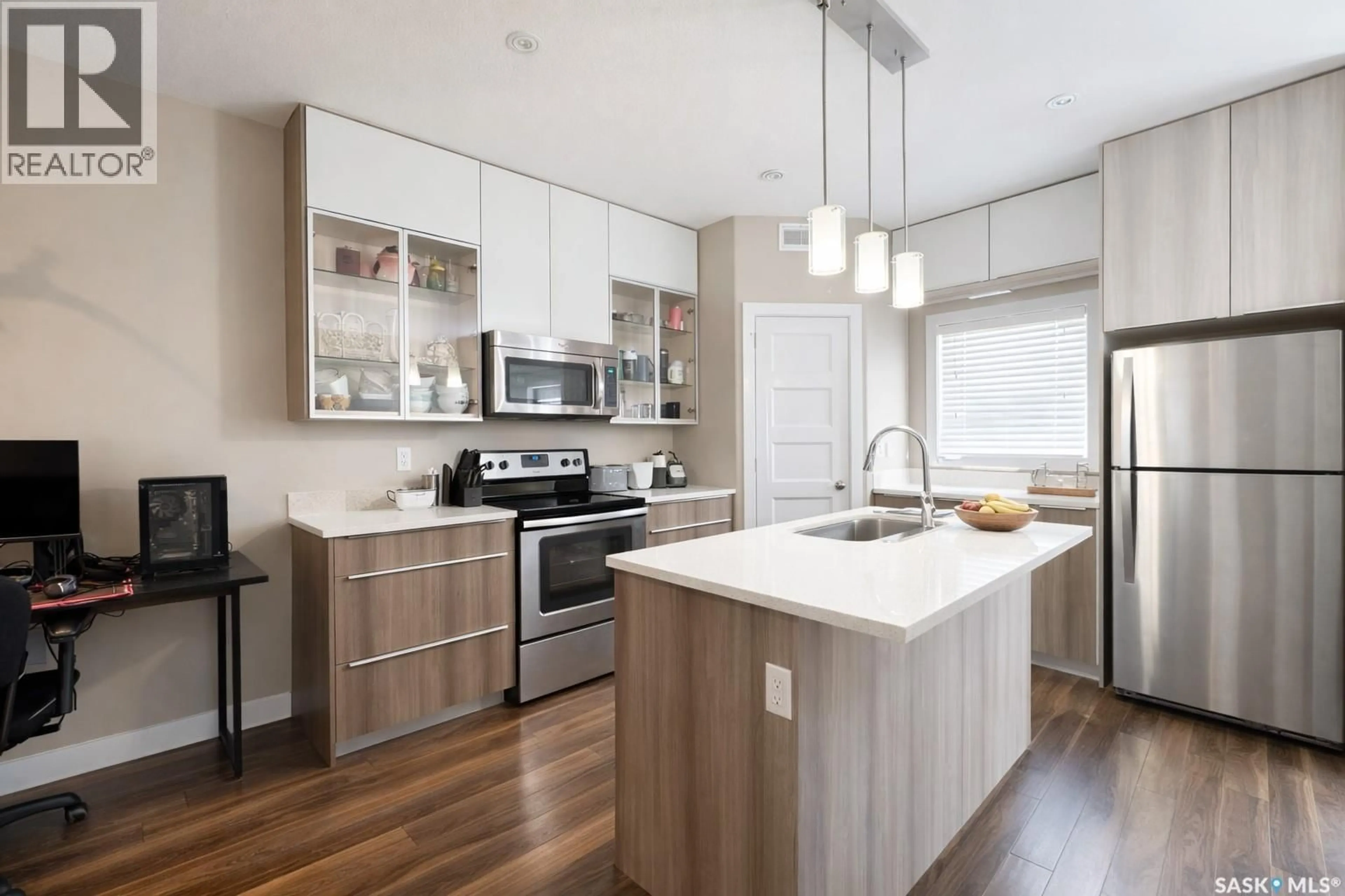 Open concept kitchen, wood/laminate floor for 1026 EVERGREEN BOULEVARD, Saskatoon Saskatchewan S7W0V9