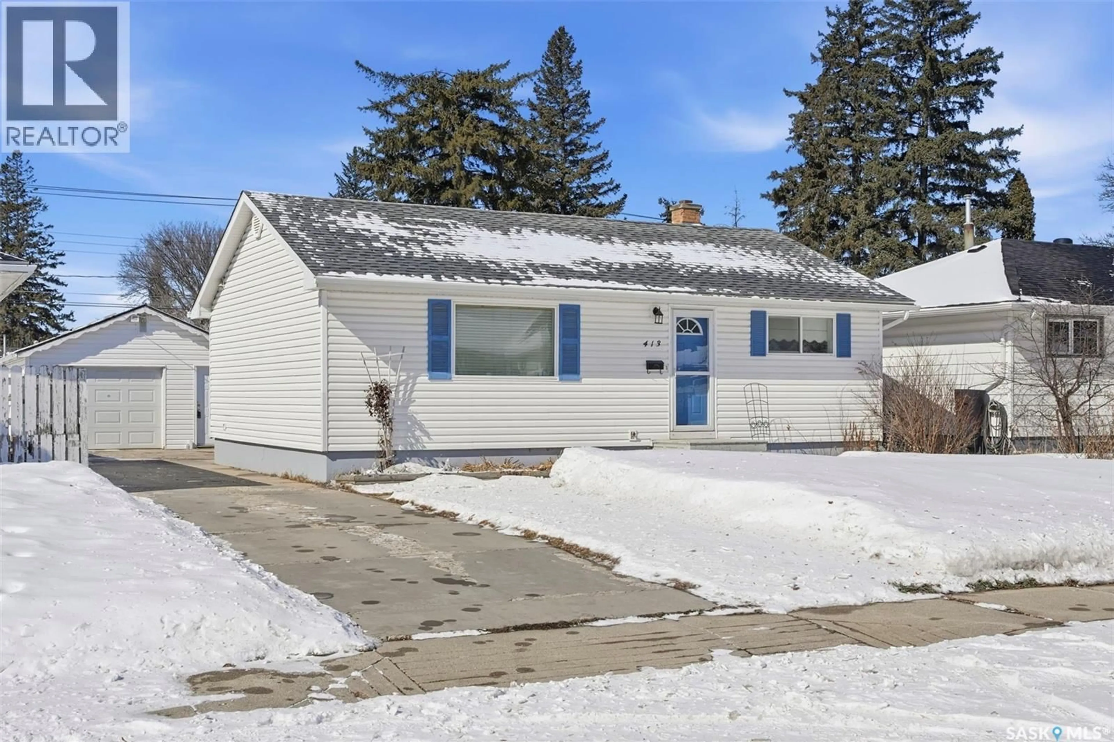 Home with vinyl exterior material, street for 413 S AVENUE N, Saskatoon Saskatchewan S7L2Z9