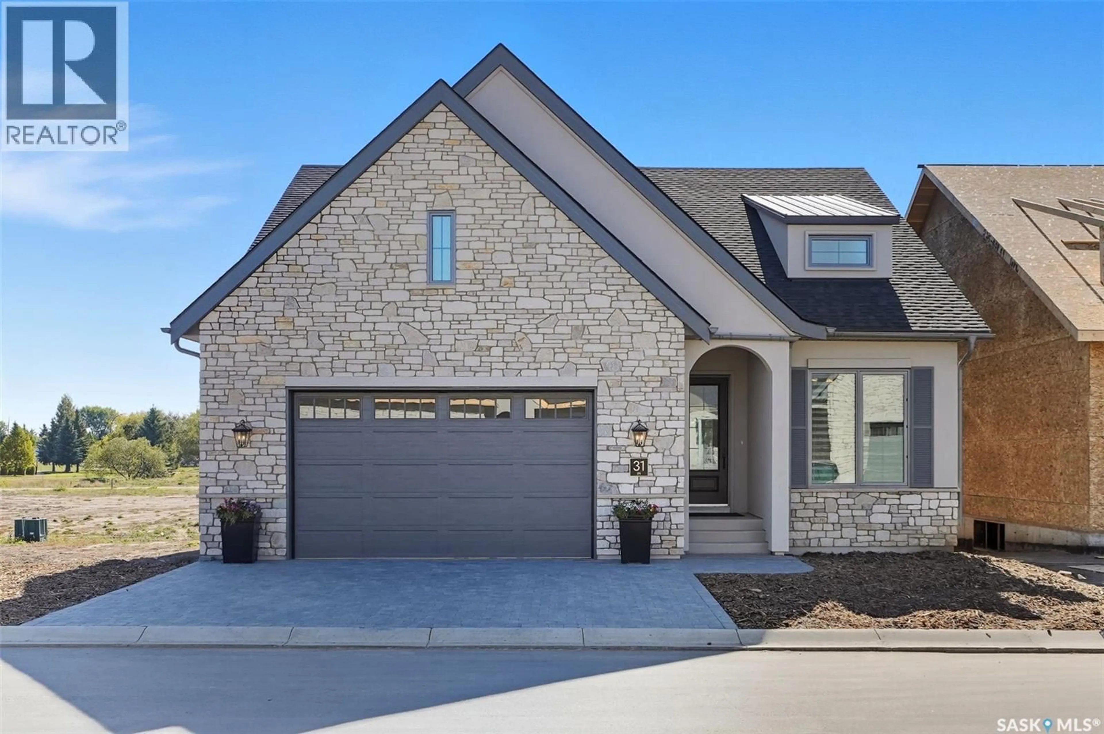 Home with brick exterior material, street for 31 350 CARTWRIGHT STREET, Saskatoon Saskatchewan S7T1B1