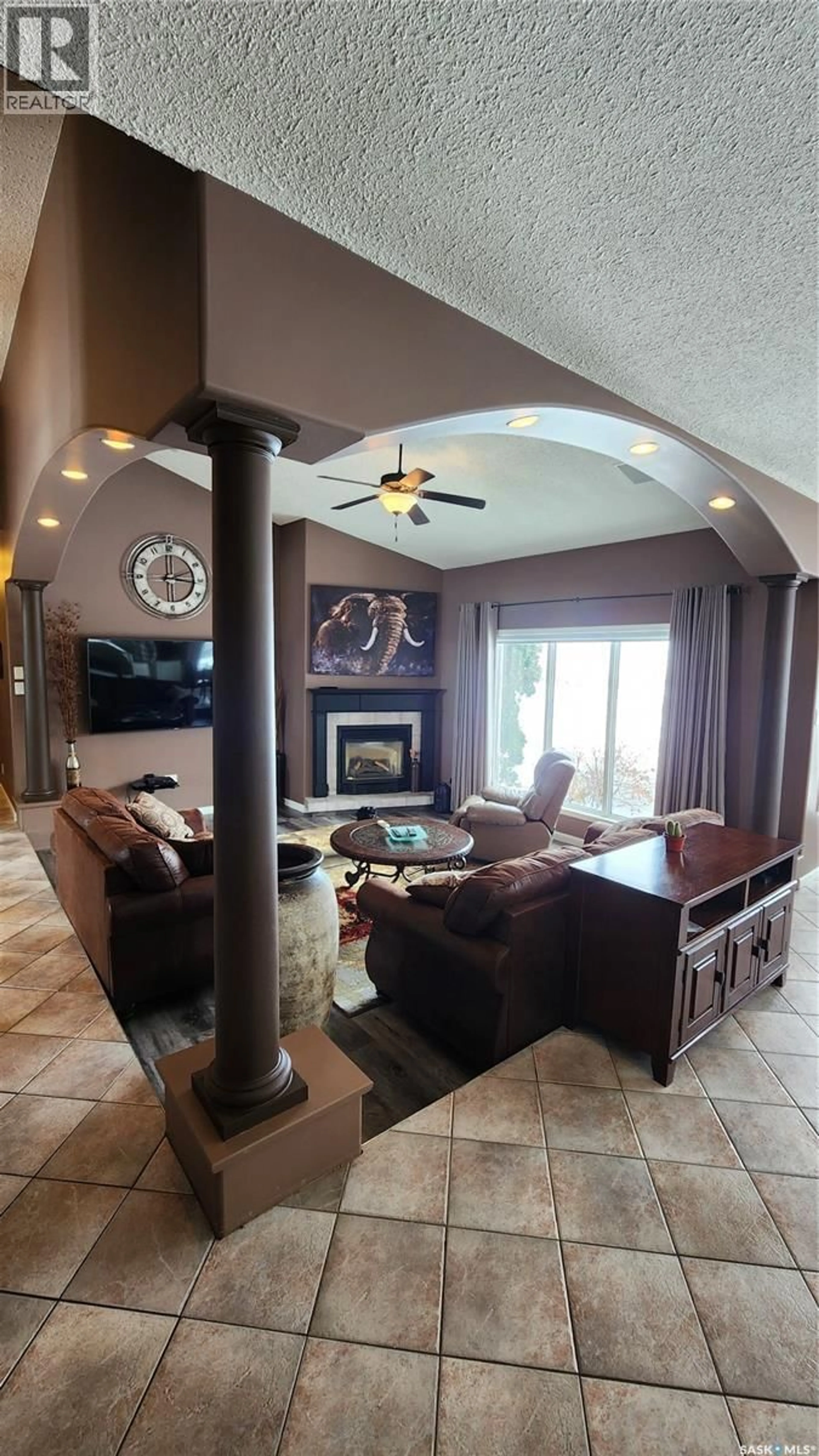 Living room with furniture, ceramic/tile floor for BRUYNOOGHE ACRES, North Battleford Rm No. 437 Saskatchewan S9A2X4