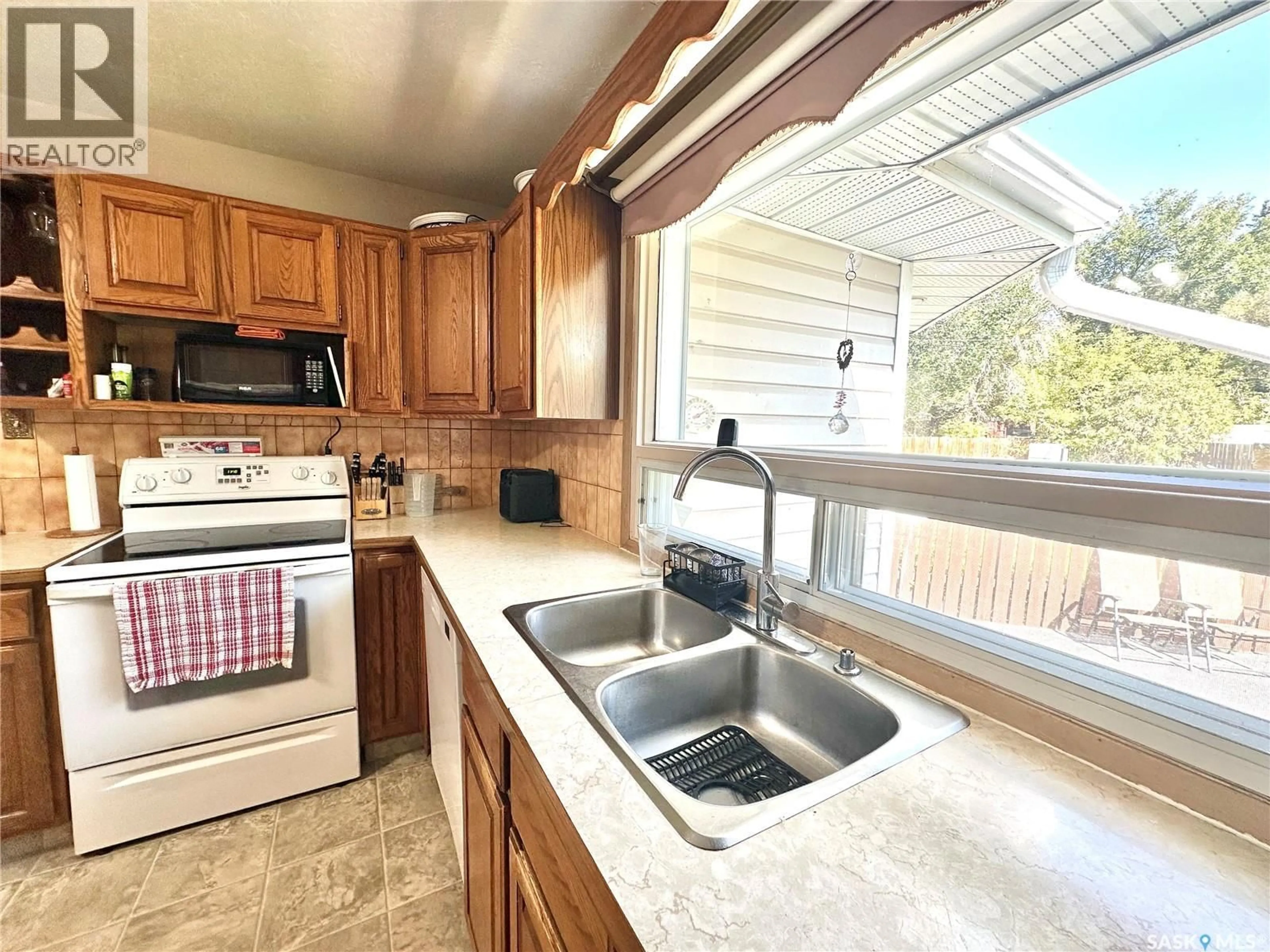 Standard kitchen, ceramic/tile floor for 1222 96TH STREET, North Battleford Saskatchewan S9A0H1