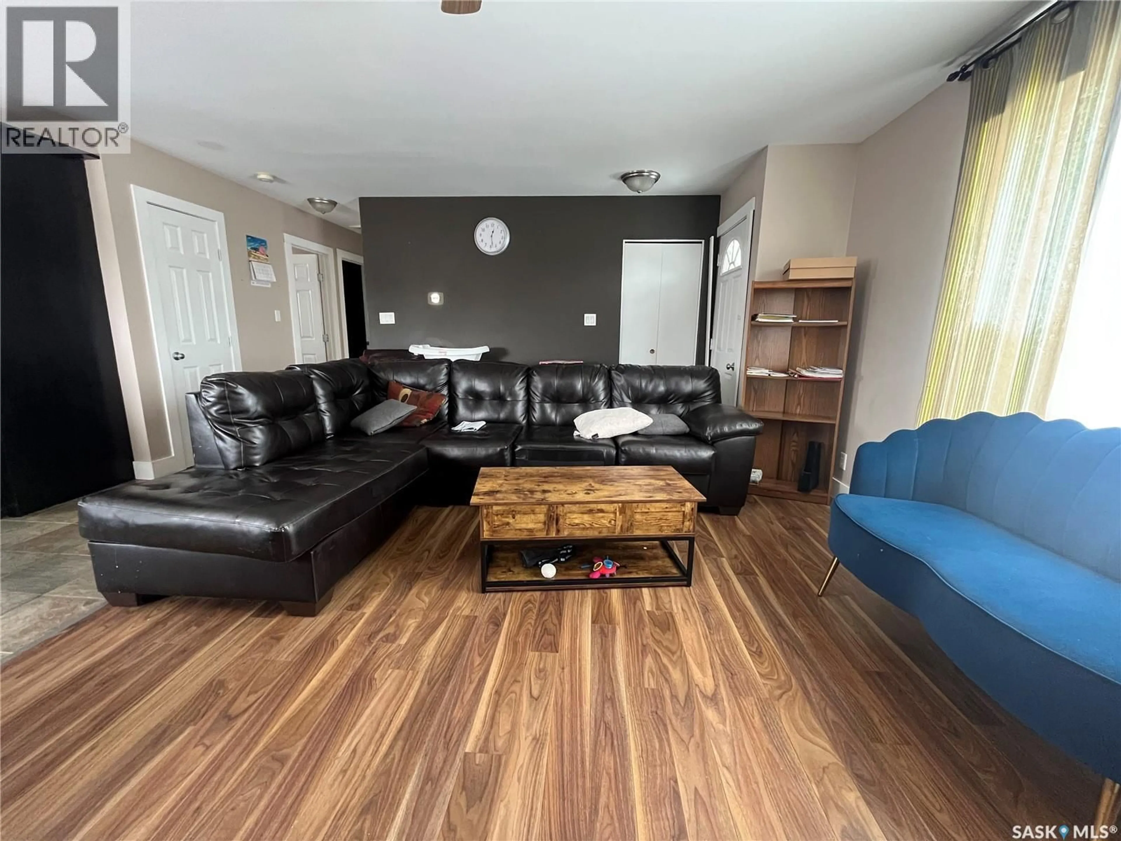 Living room with furniture, wood/laminate floor for 319 PELLY STREET, Rocanville Saskatchewan S0A3L0