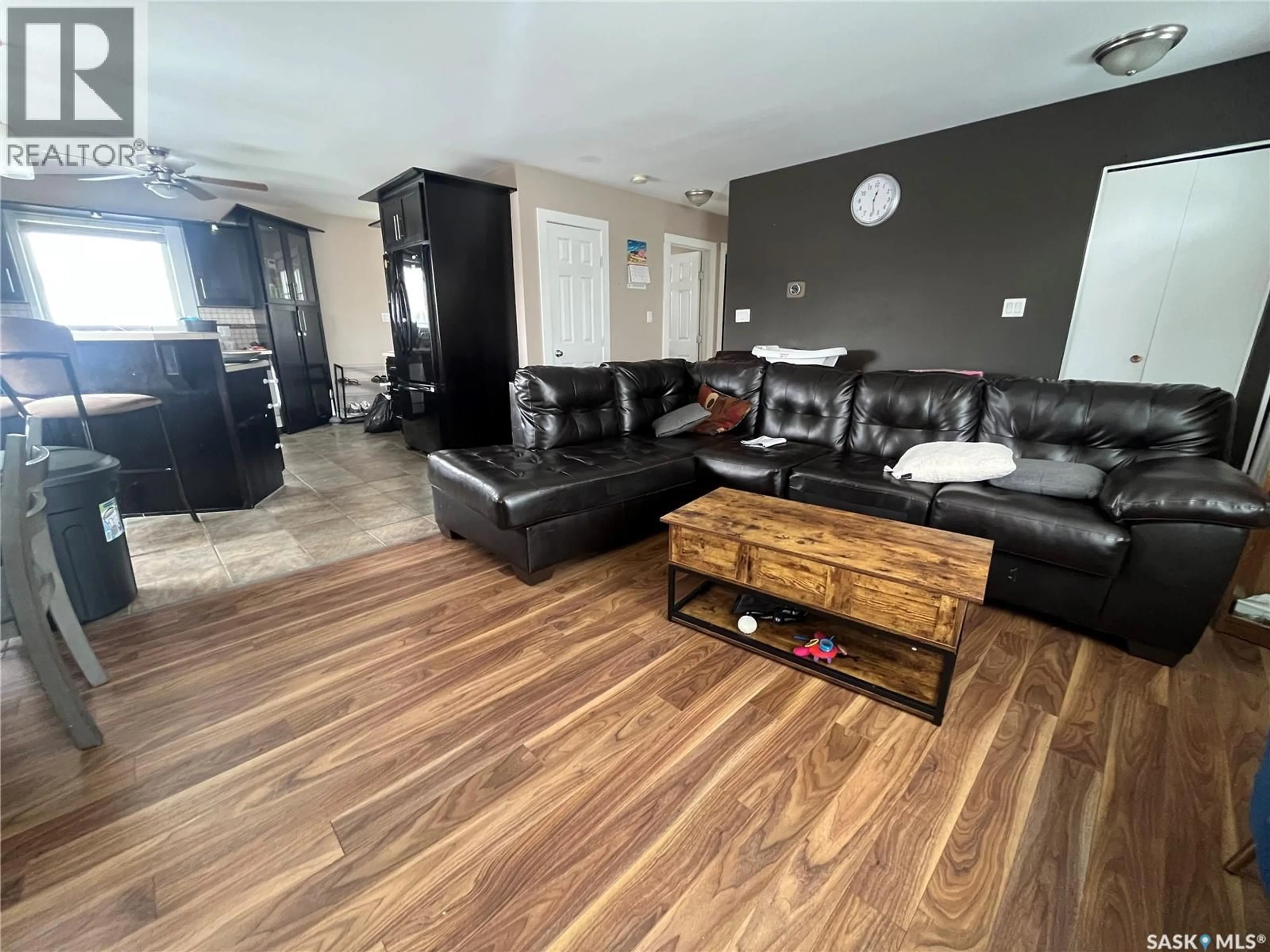 Living room with furniture, wood/laminate floor for 319 PELLY STREET, Rocanville Saskatchewan S0A3L0
