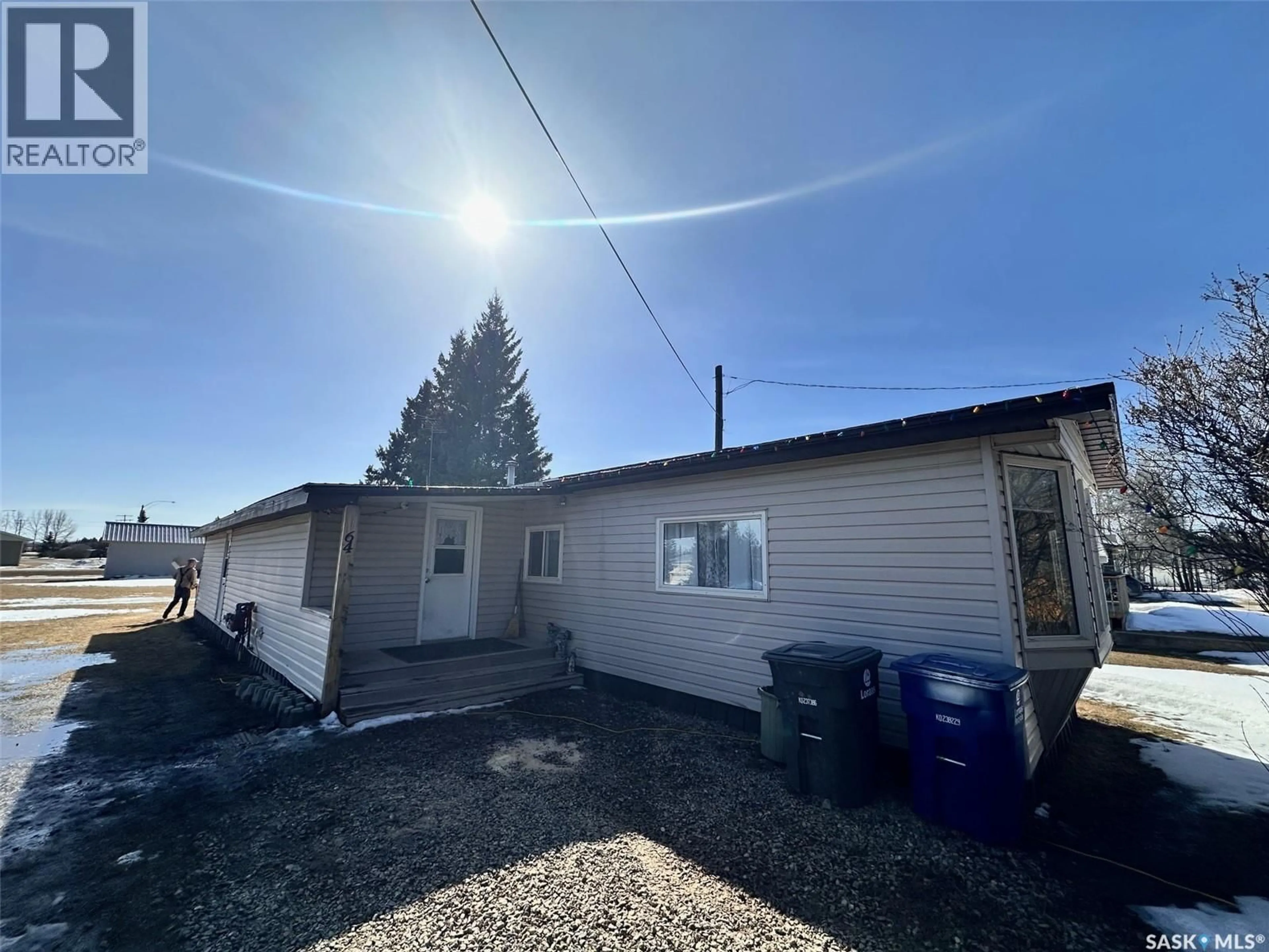 A pic from outside/outdoor area/front of a property/back of a property/a pic from drone, unknown for 64 1ST AVENUE, Leoville Saskatchewan S0J1N0