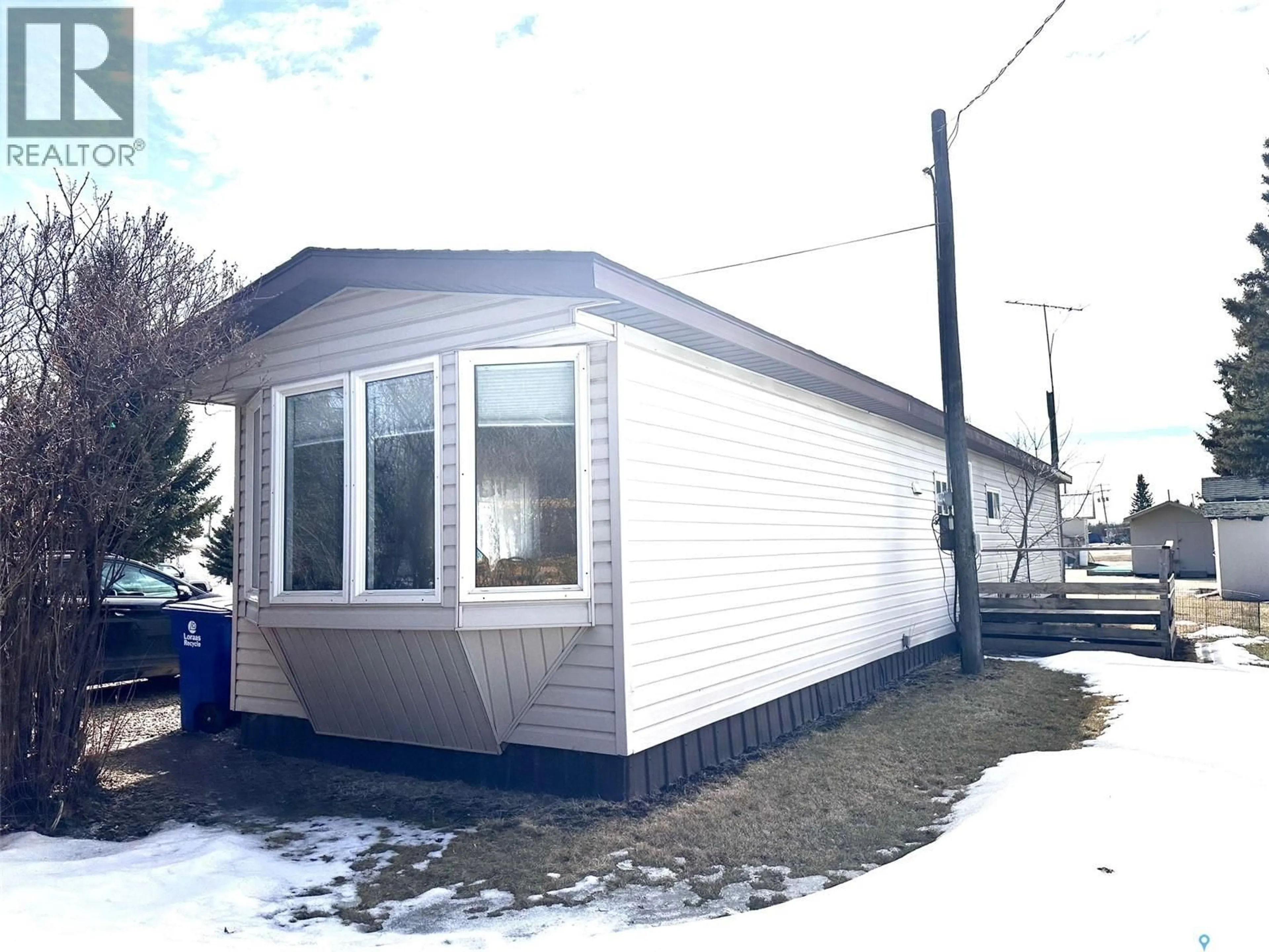 Home with vinyl exterior material, street for 64 1ST AVENUE, Leoville Saskatchewan S0J1N0