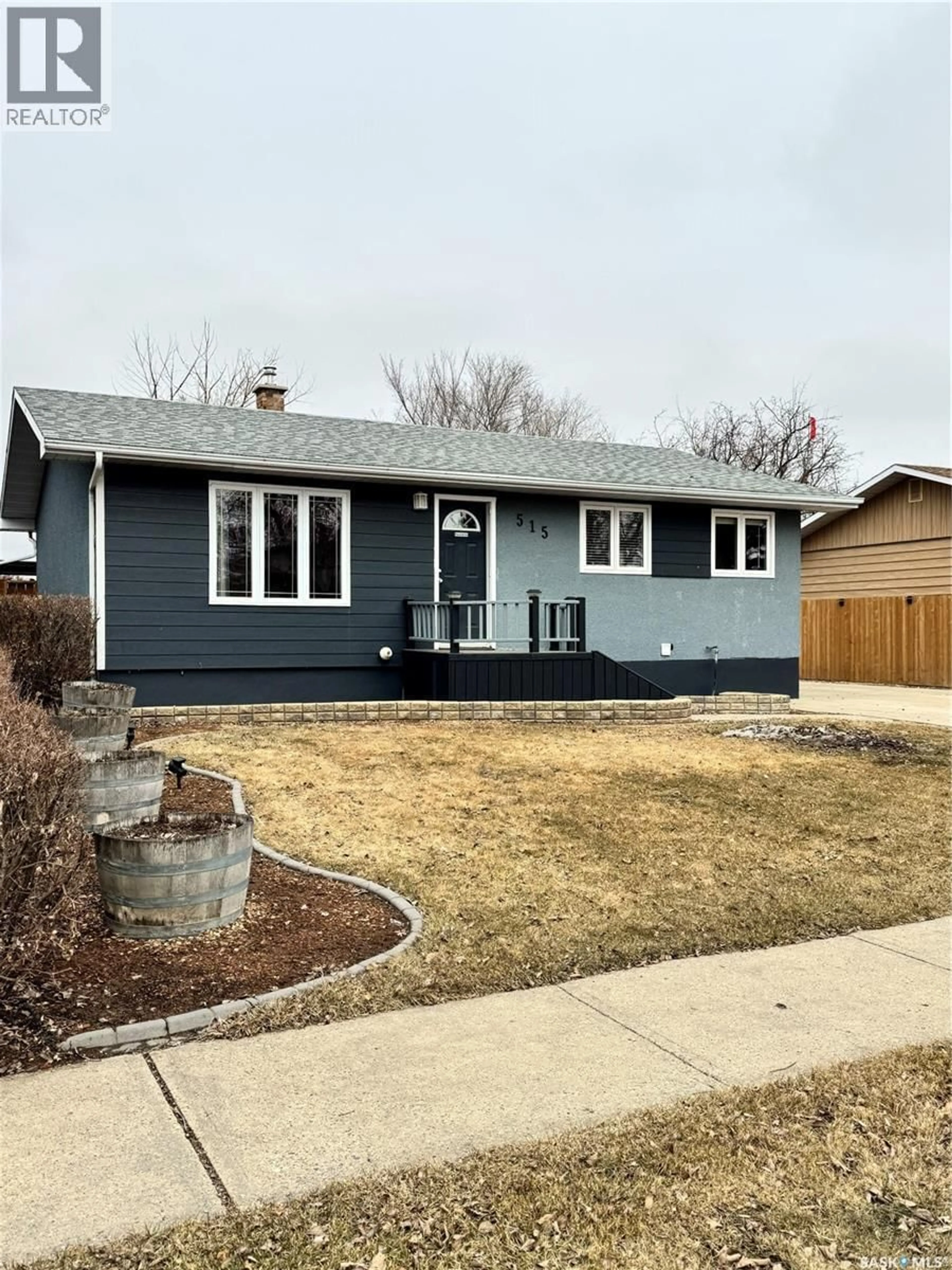 Home with vinyl exterior material, street for 515 3RD AVENUE, Weyburn Saskatchewan S4H1R2