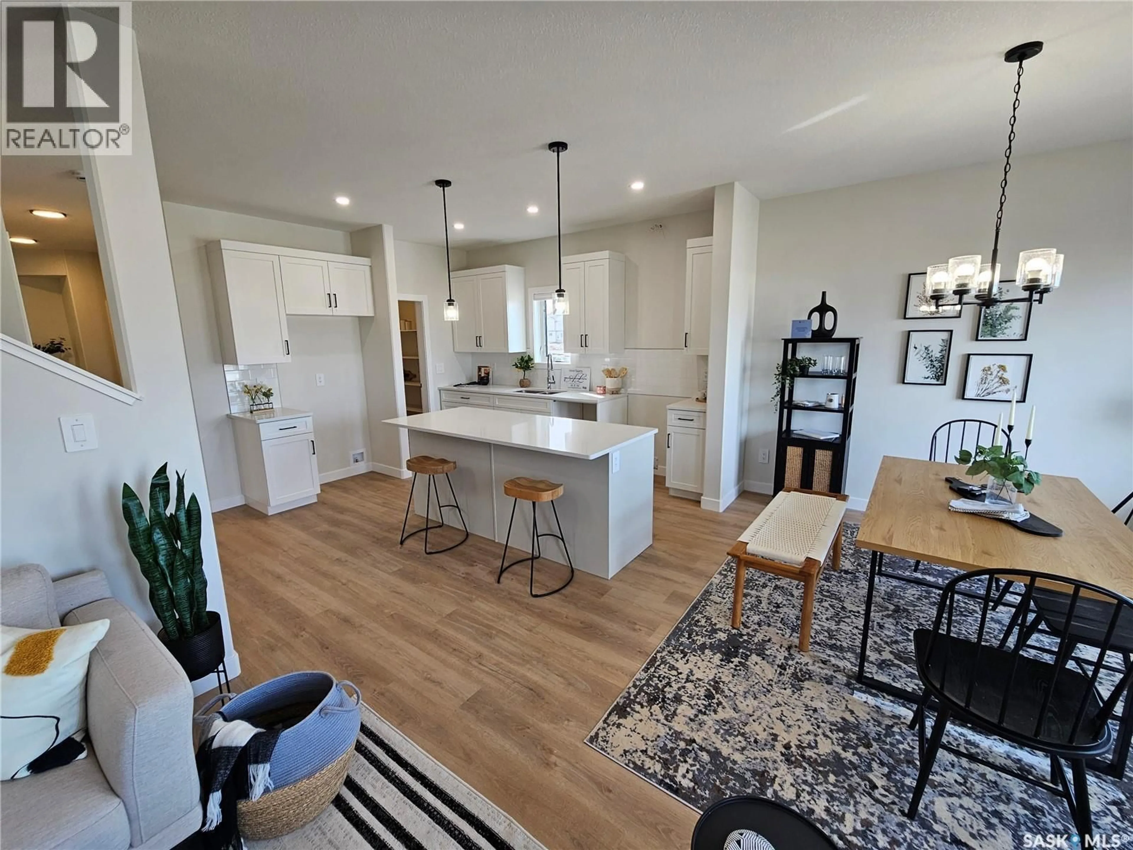 Open concept kitchen, wood/laminate floor for 8 VANCOUVER CRESCENT, Pilot Butte Saskatchewan S0G3Z0