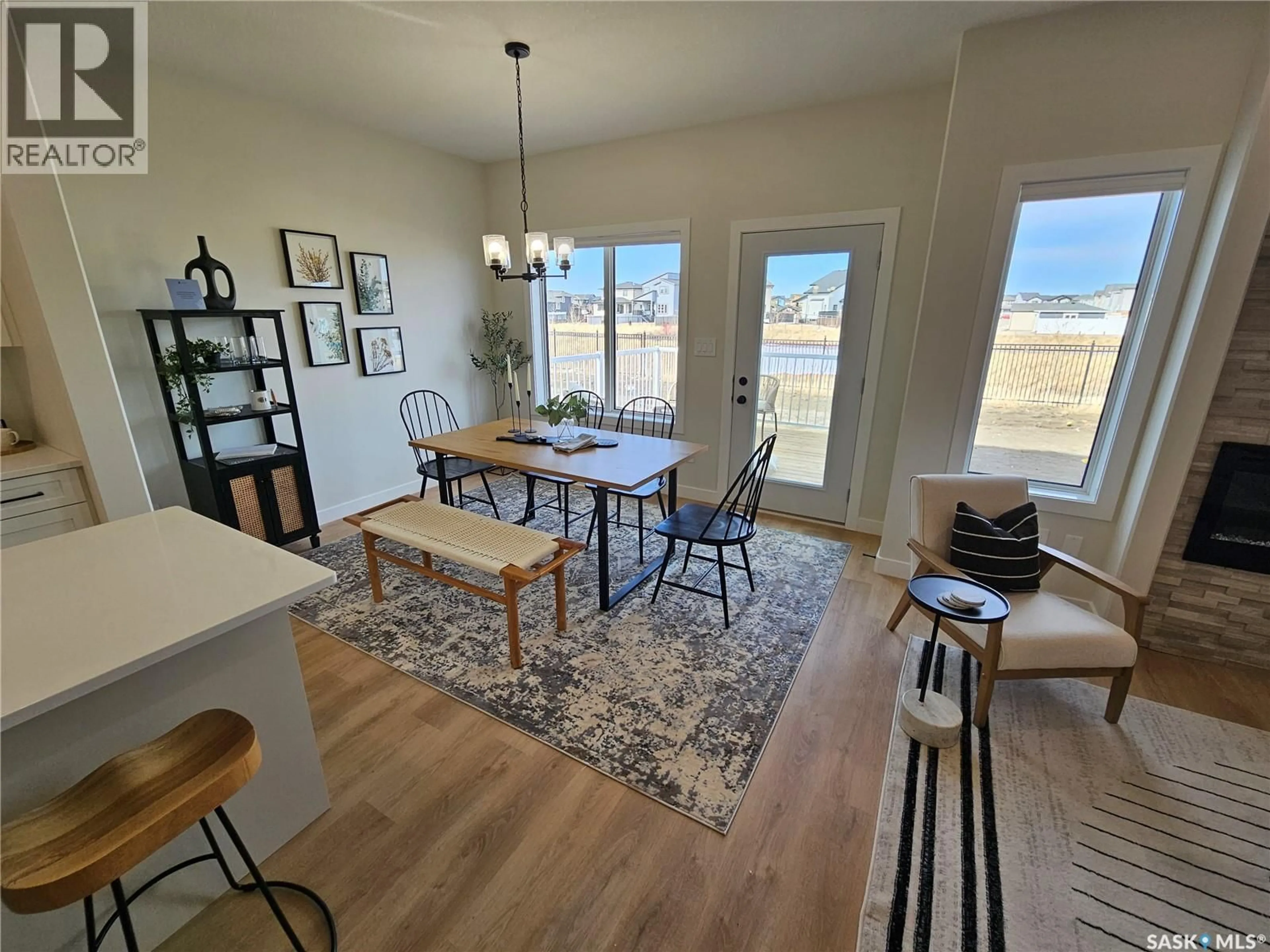 Dining room, wood/laminate floor for 8 VANCOUVER CRESCENT, Pilot Butte Saskatchewan S0G3Z0