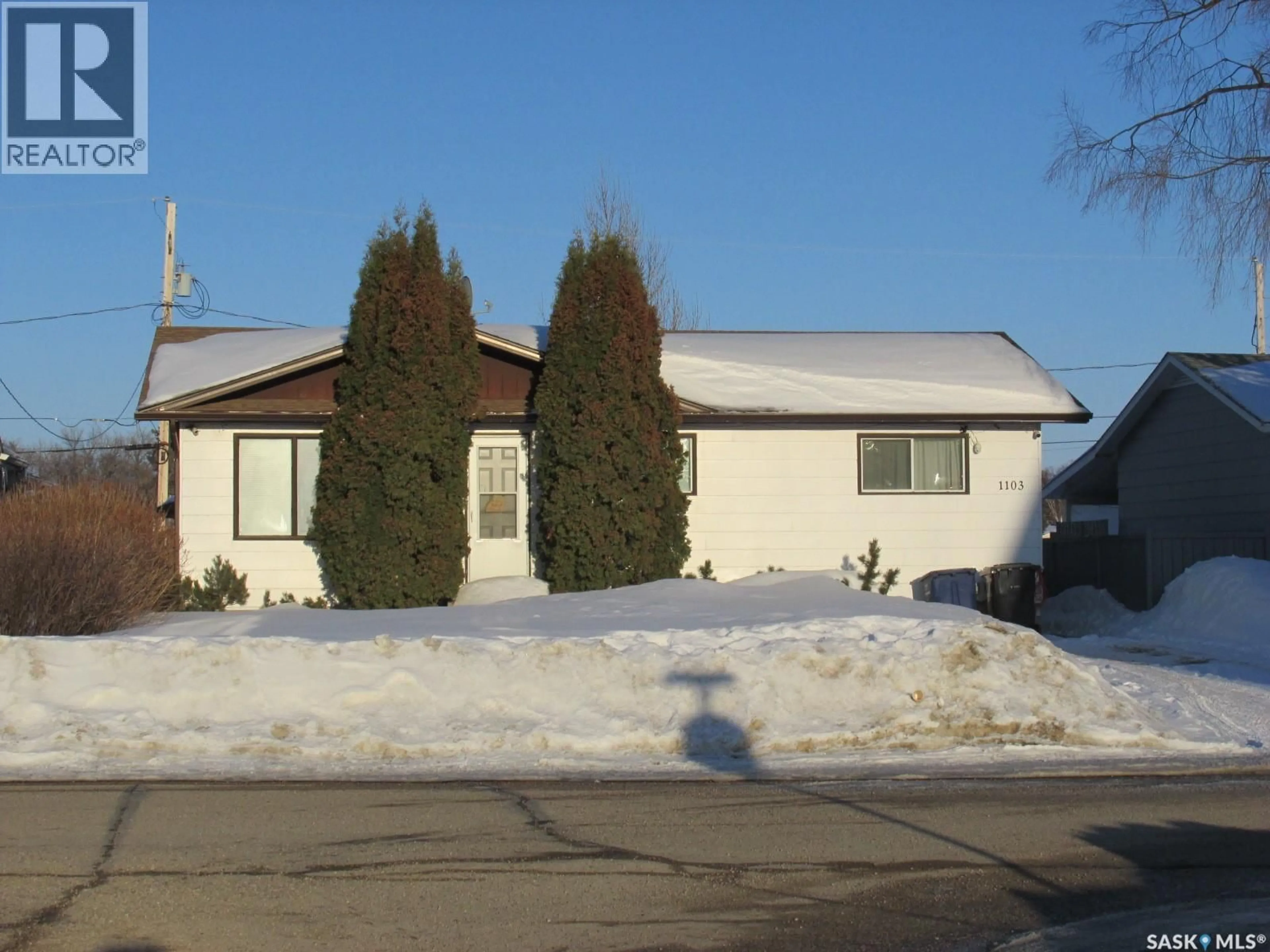 Home with vinyl exterior material, street for 1103 3RD STREET, Nipawin Saskatchewan S0E1E0