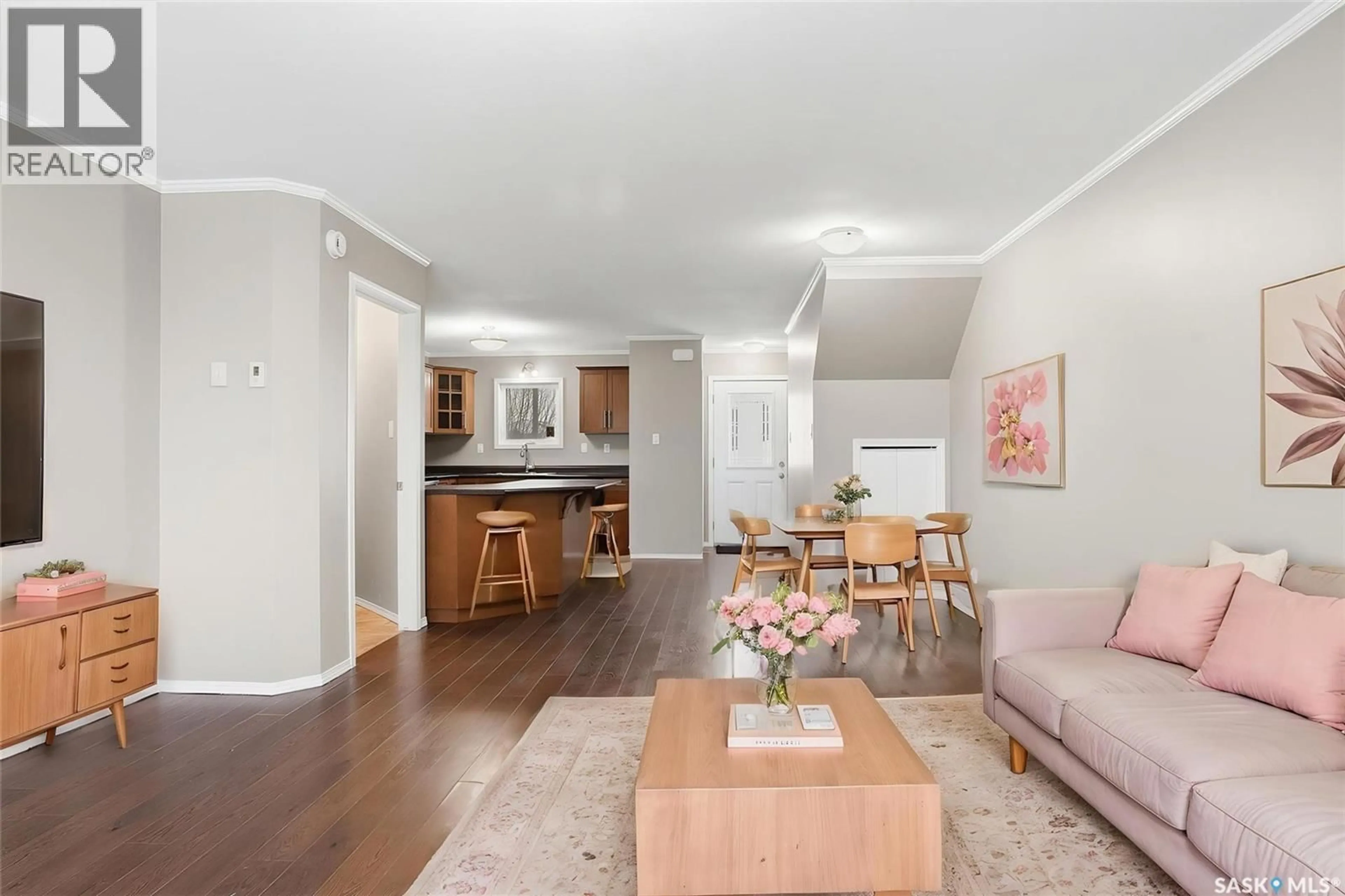 Living room with furniture, wood/laminate floor for 210 - 275 PRINGLE LANE, Saskatoon Saskatchewan S7T0T5